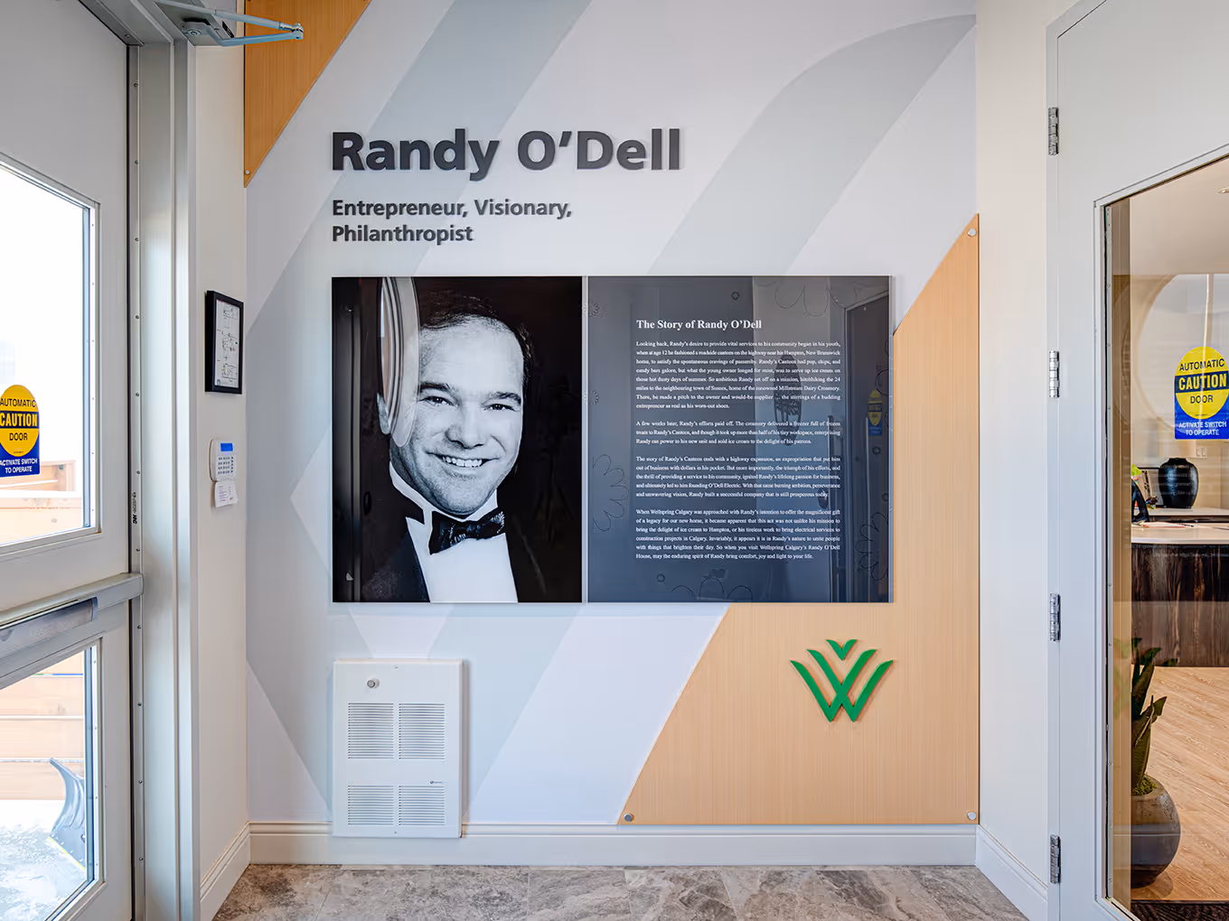 Close-up of Randy O’Dell donor recognition display, combining large-format portrait photography, storytelling panels, and branded graphic elements.