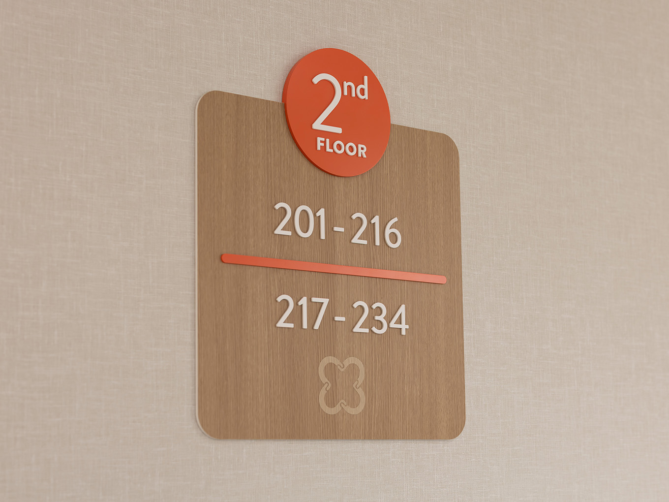 Floor identifier sign for the second floor at United Active Living Garrison Green, with a coral circular badge, dimensional white room numbers, and the United logo at the base.