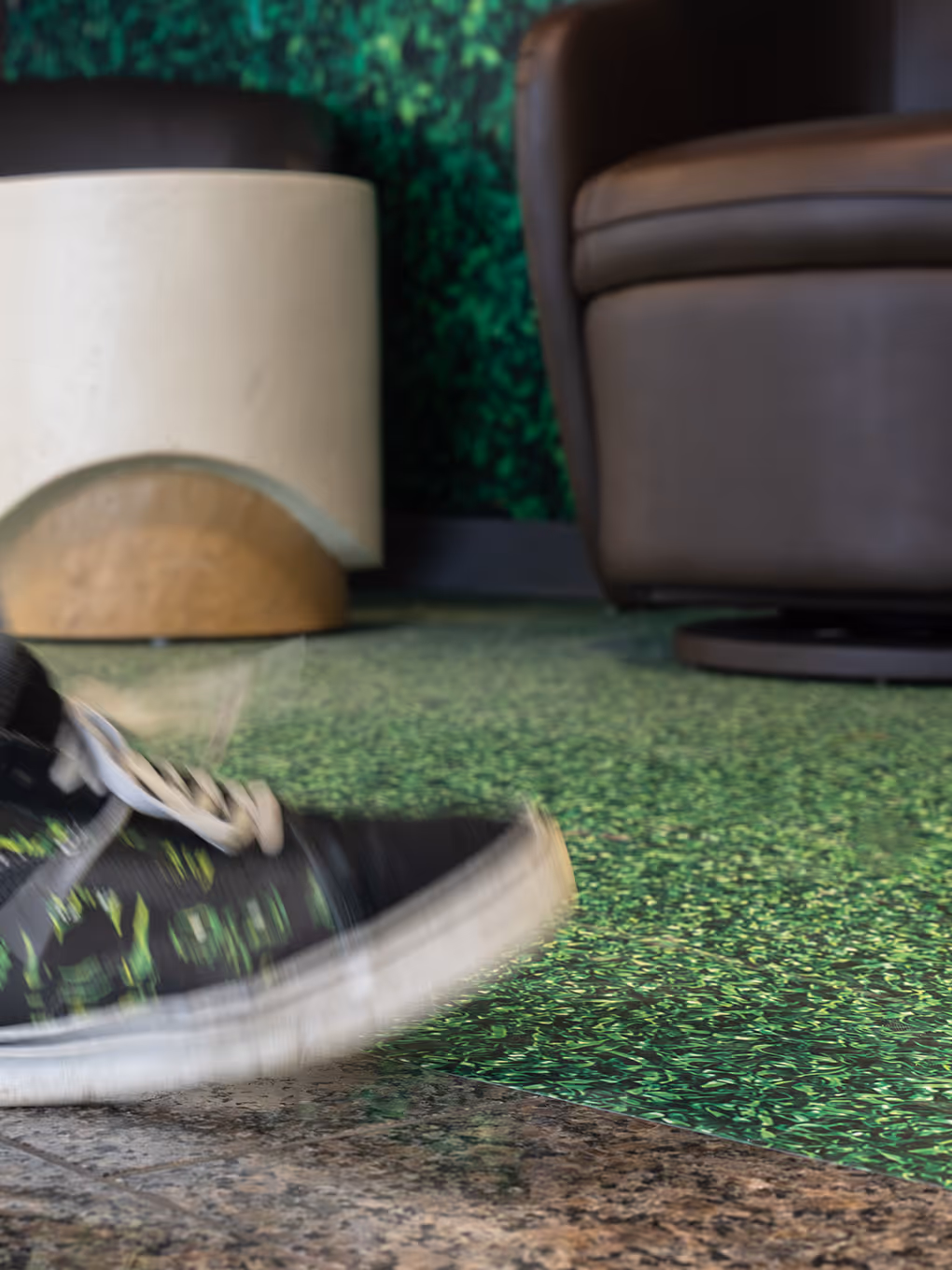 Close-up of artificial grass flooring detail inside Fuze Iced Tea Flavour Lounge experiential activation at Calgary Airport