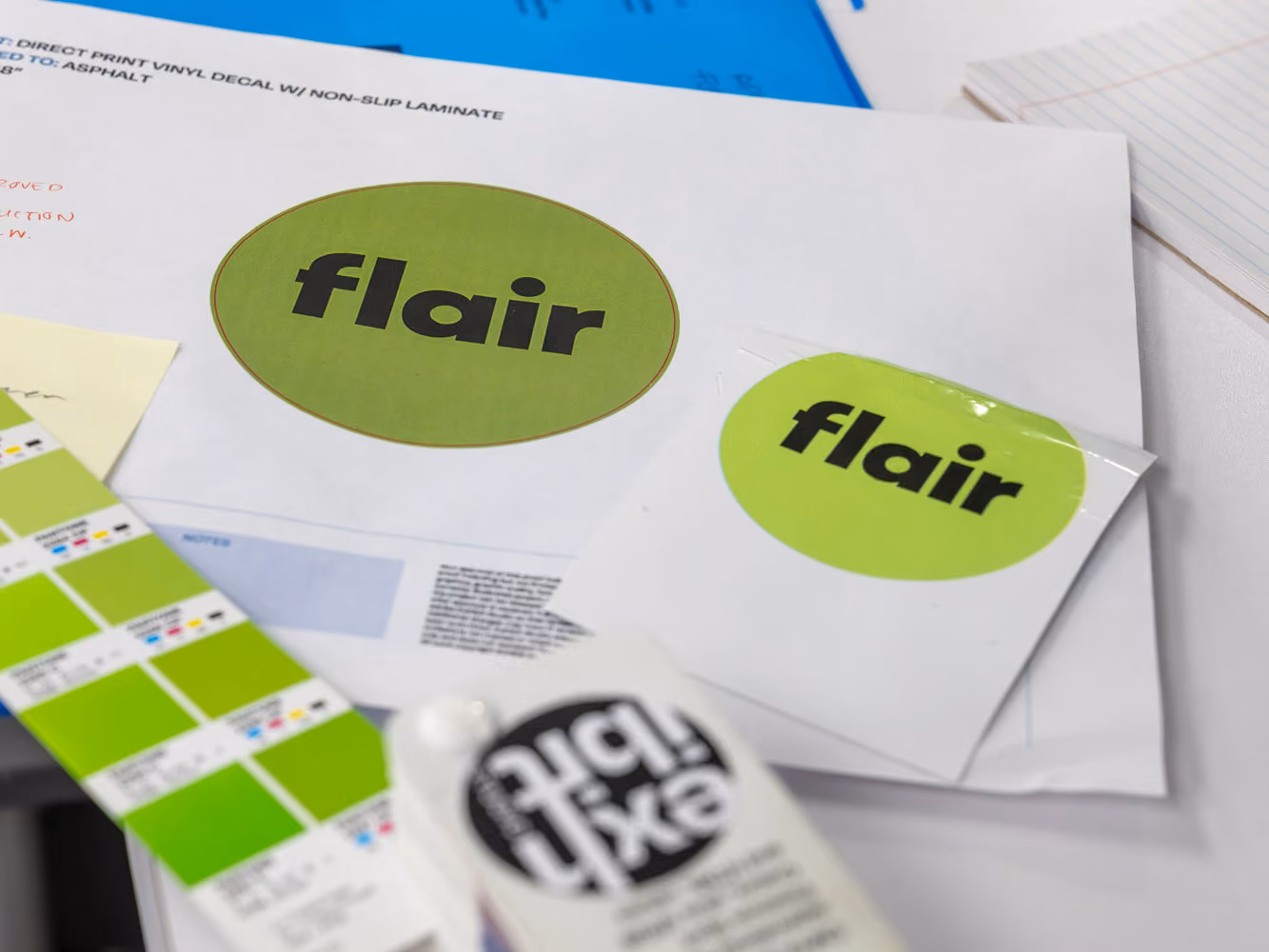 Print proof of the green Flair circle floor decal beside a finished sample and colour swatches.