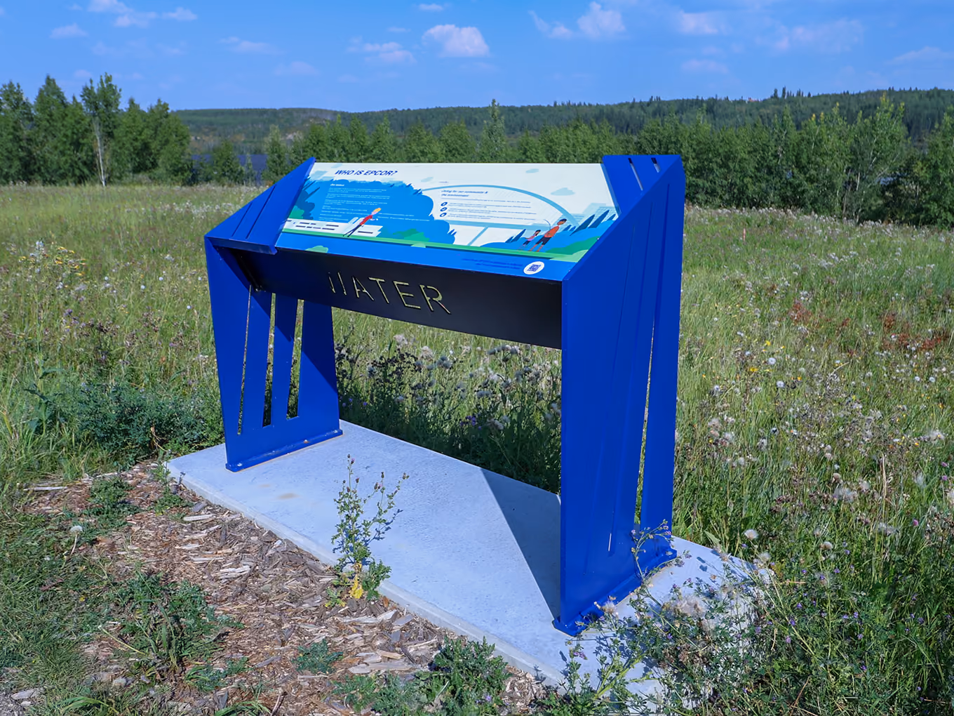	"Water" interpretive sign in an open field, topped with a "Who is EPCOR?" graphic panel.