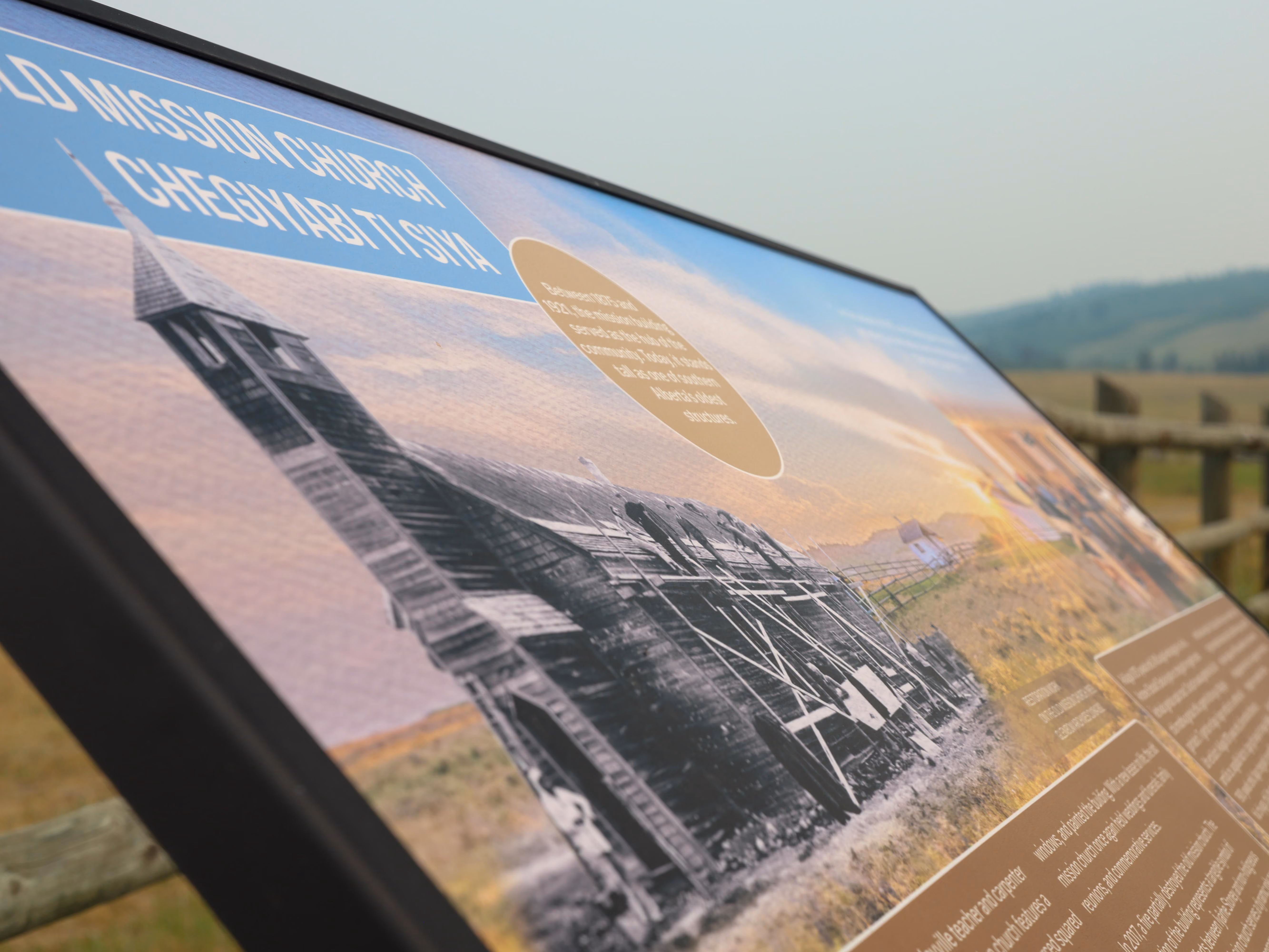 Close-up detail of the Old Mission Church panel showing a historic photo of the original structure.