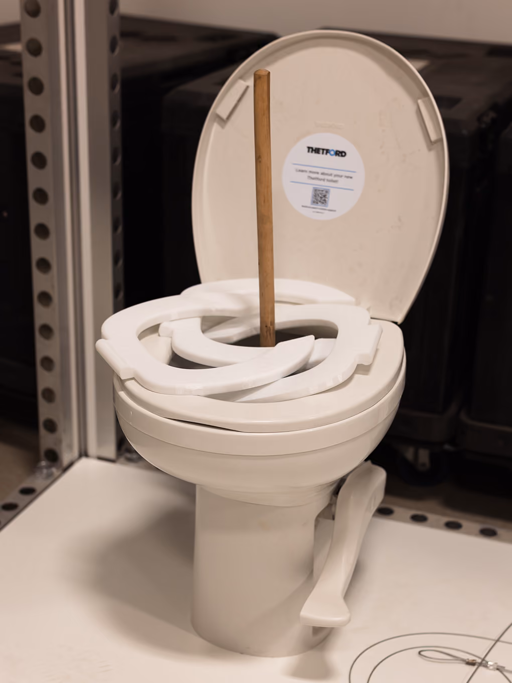 3D-printed toilet seats and an epoxy-set plunger form the ring toss game prop for the RV activation.