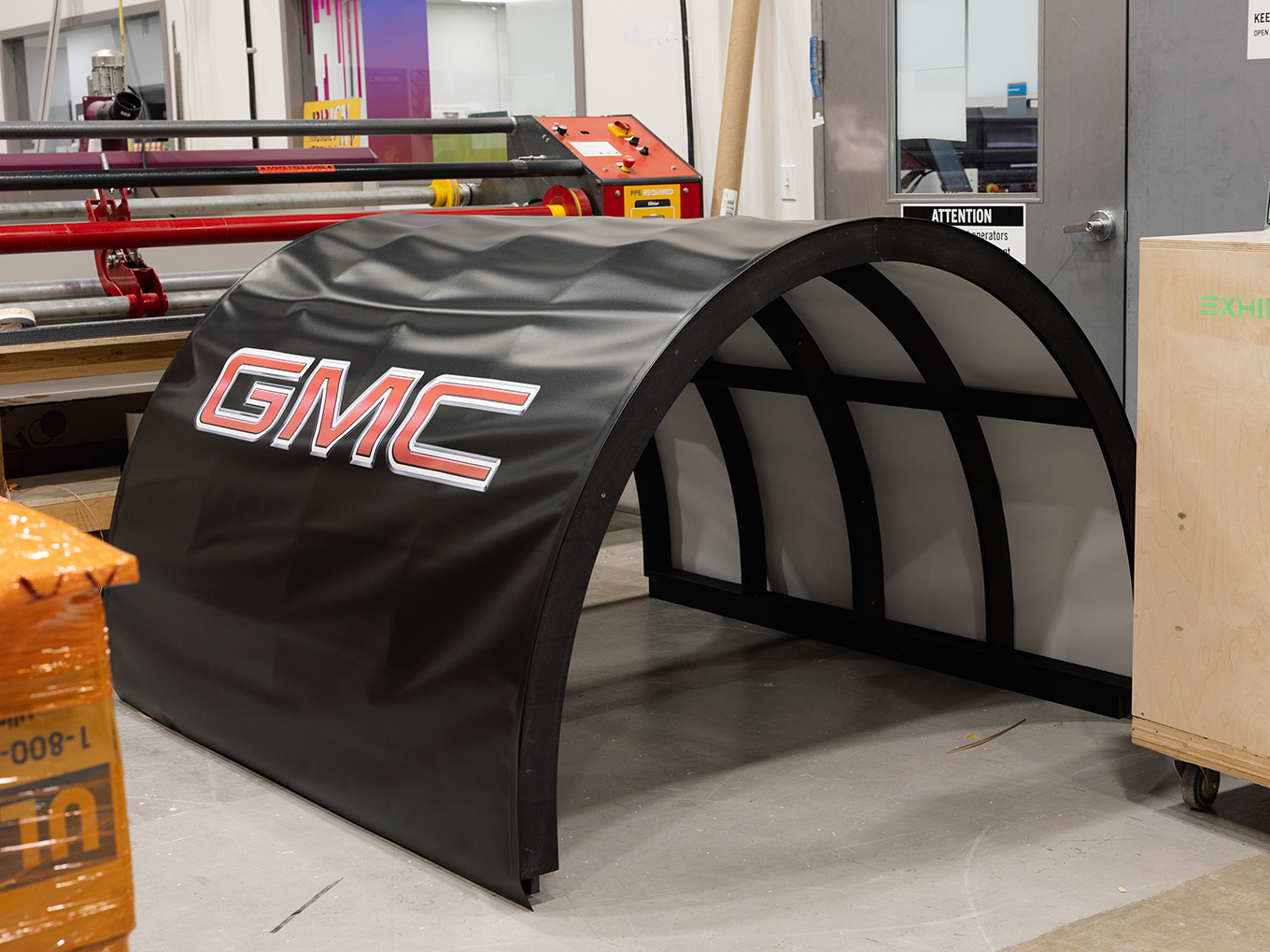 Custom-fabricated GMC-branded chuckwagon cover frame prepared for the Stampede parade truck build.