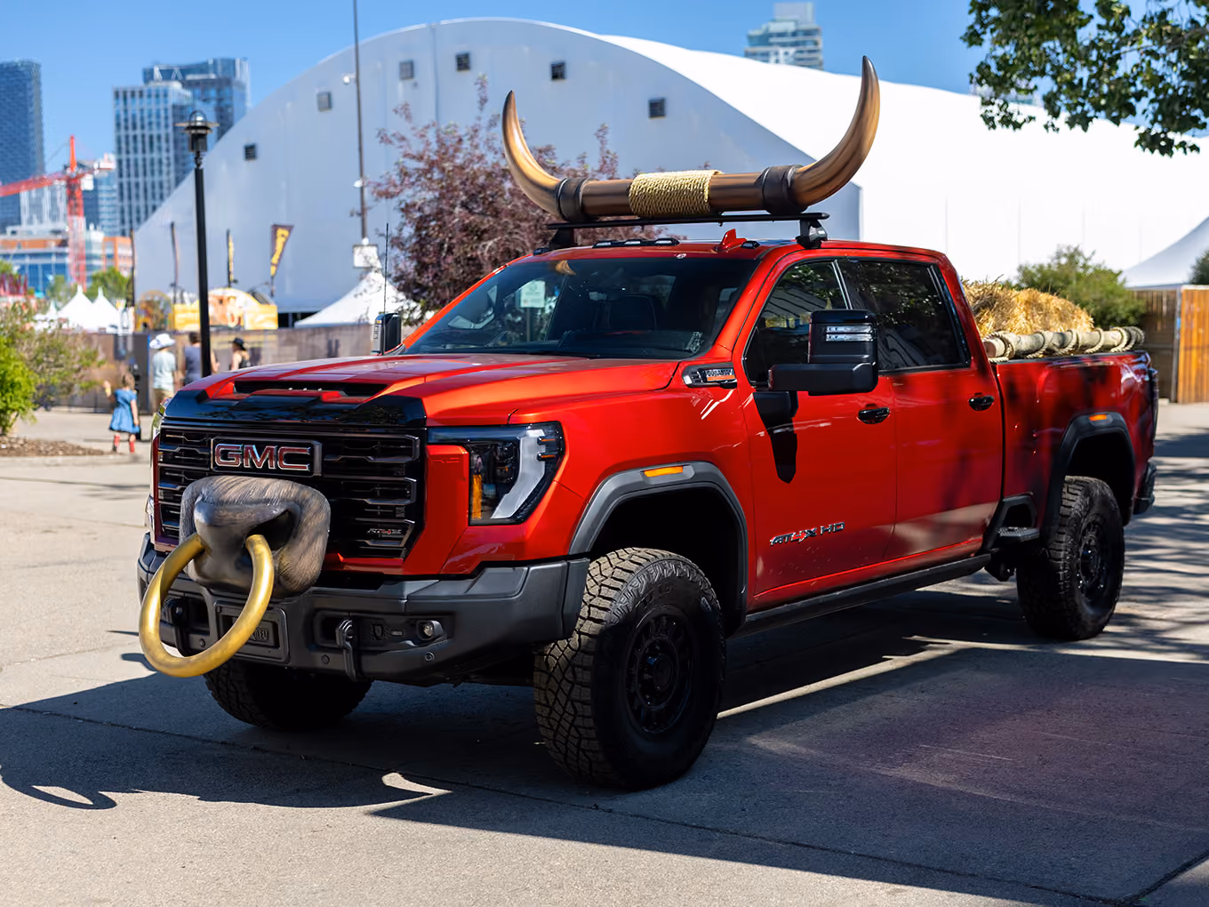 Front three-quarter view of the custom GMC truck display with fabricated bull horns and nose ring.