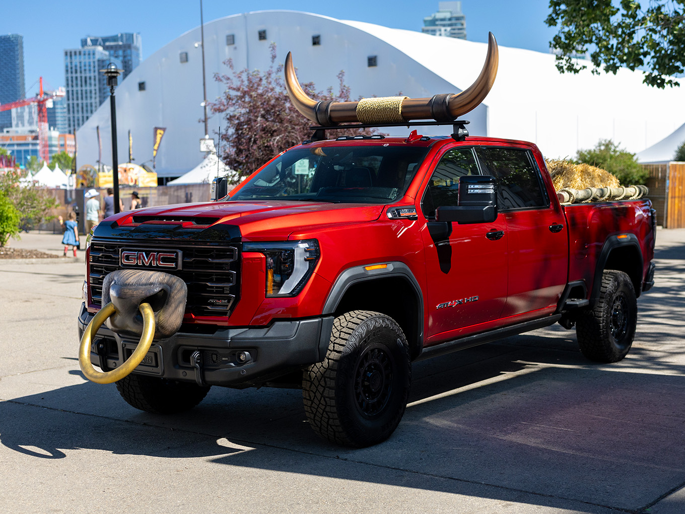 Front three-quarter view of the custom GMC truck display with fabricated bull horns and nose ring.