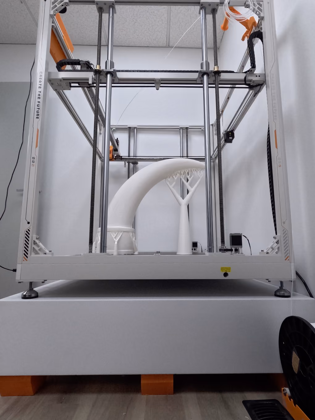 Large-scale 3D printer forming the custom bull horn shape for the GMC Stampede parade truck.
