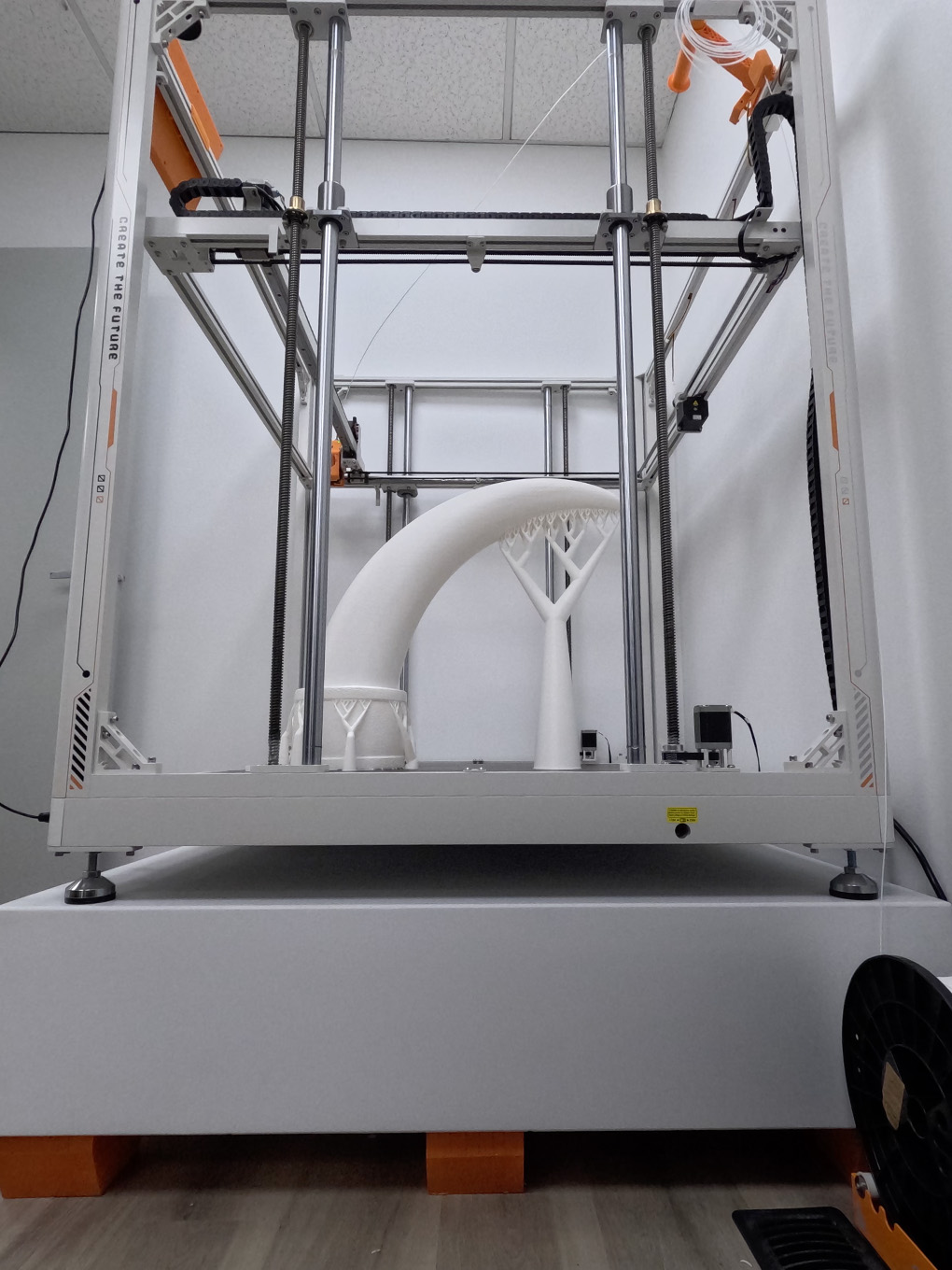 Large-scale 3D printer forming the custom bull horn shape for the GMC Stampede parade truck.