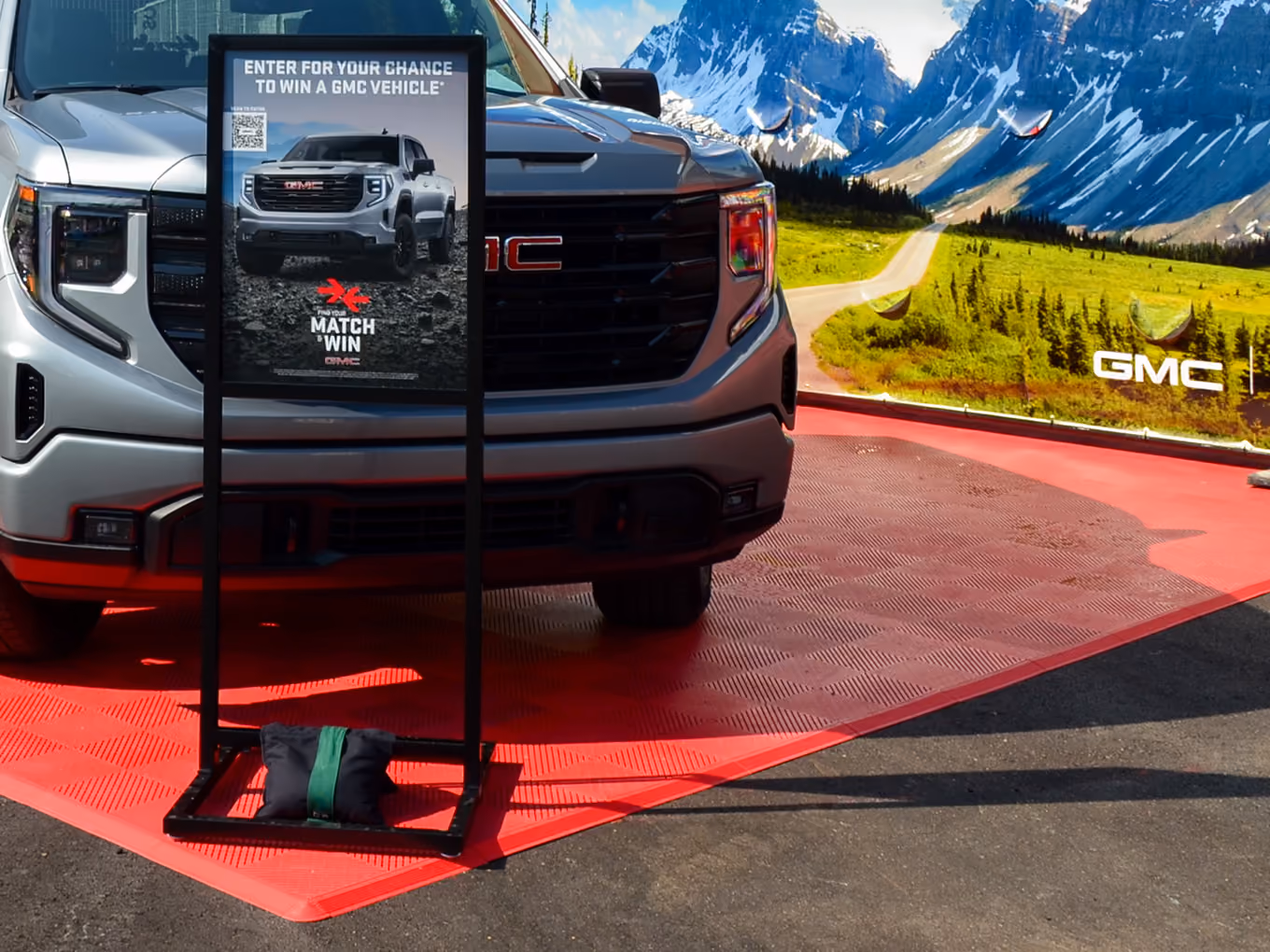 GMC Sierra satellite vehicle display with rental freestanding sign display