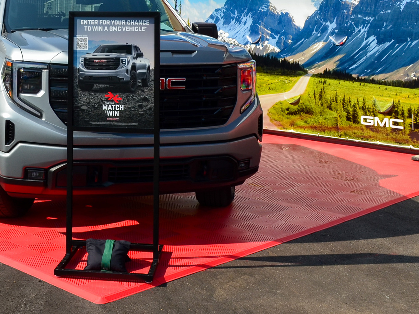 GMC Sierra satellite vehicle display with rental freestanding sign display