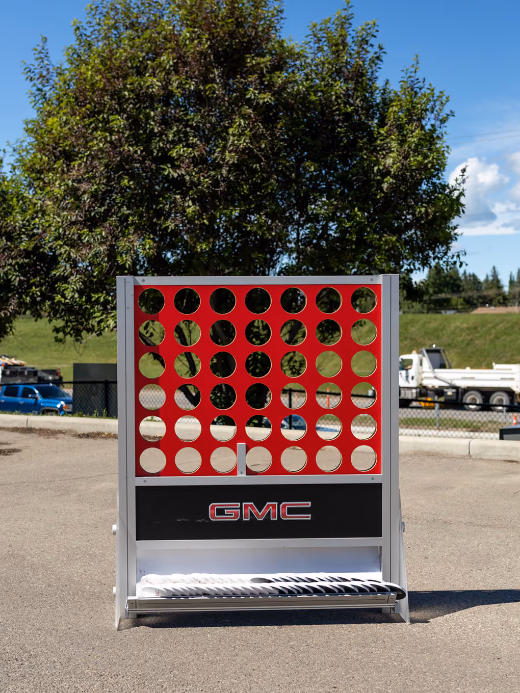 Oversized GMC-branded Connect 4 game staged outdoors for a Calgary Stampede activation.