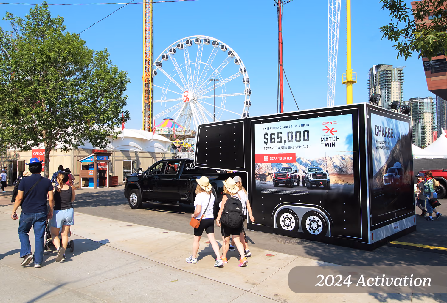 RV 5th wheel display concealing a power transformer box for GMC at the Calgary Stampede midway