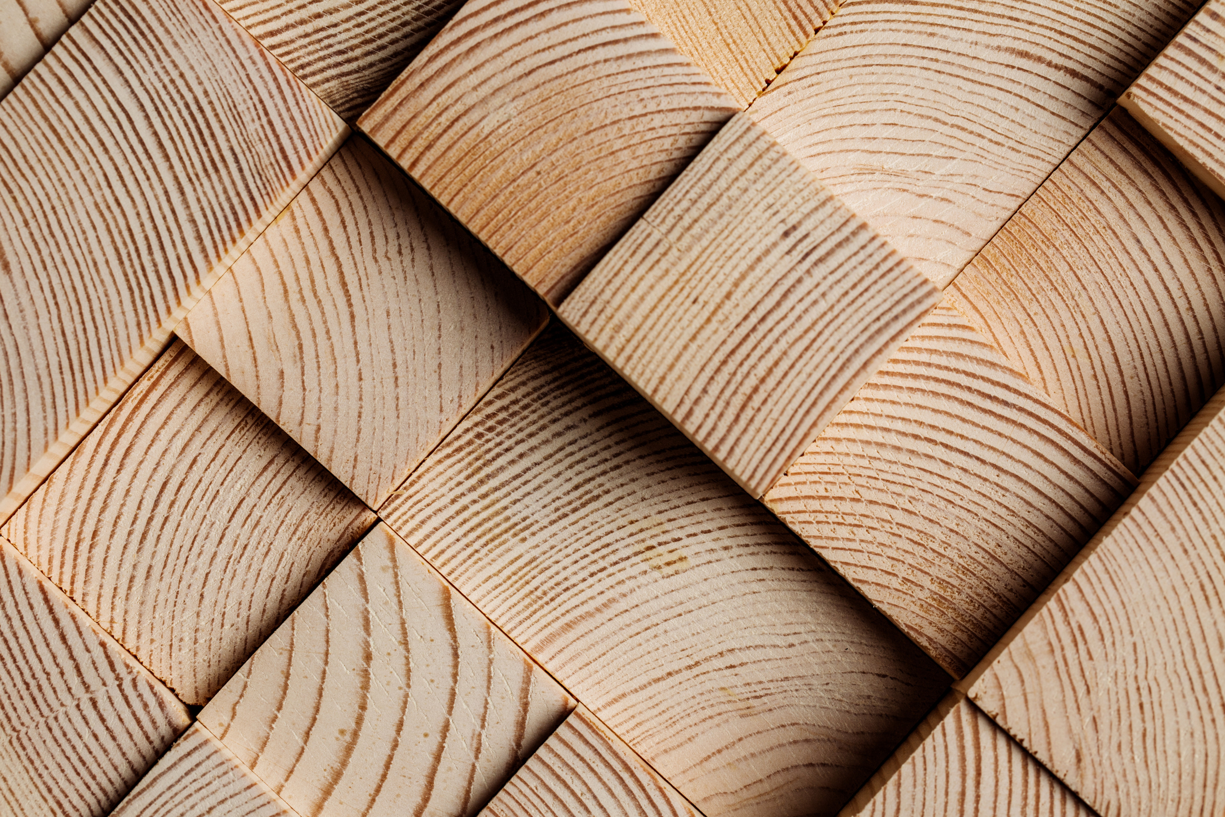 Close-up of interwoven wooden blocks with natural grain patterns.