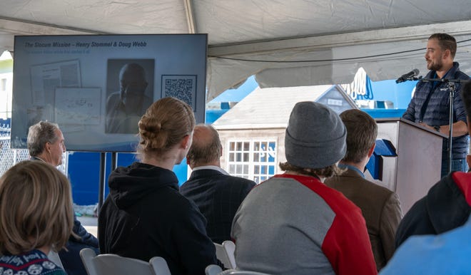 Teledyne's Shea Quinn welcomes the crowd to the Woods Hole Oceanographic Docks for the kick off ceremony of the Sentinel Mission, sending an robotic autonomous underwater glider named Redwing around the world . Photo taken on Oct. 10, 2025