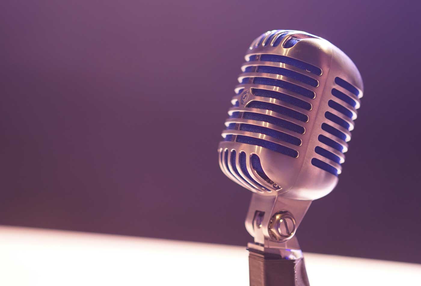 Shows a microphone on a studio desk - What is a Public Relations campaign
