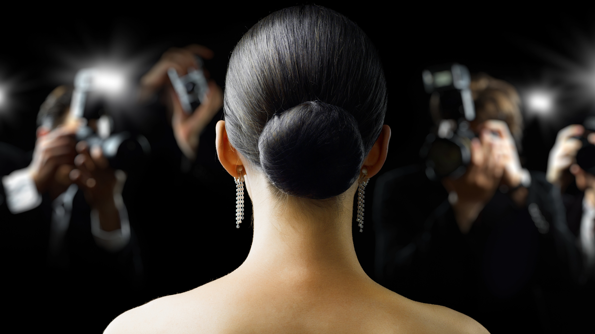 photographers and back of woman's head 