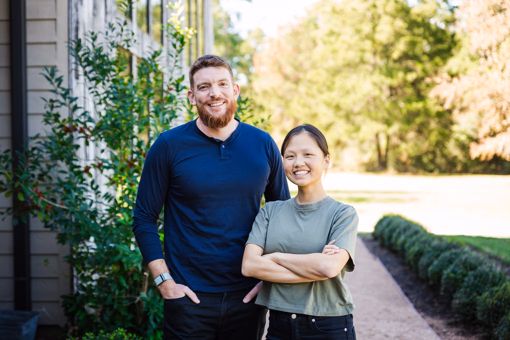 The co-founders of FreeWill standing side-by-side and smiling.