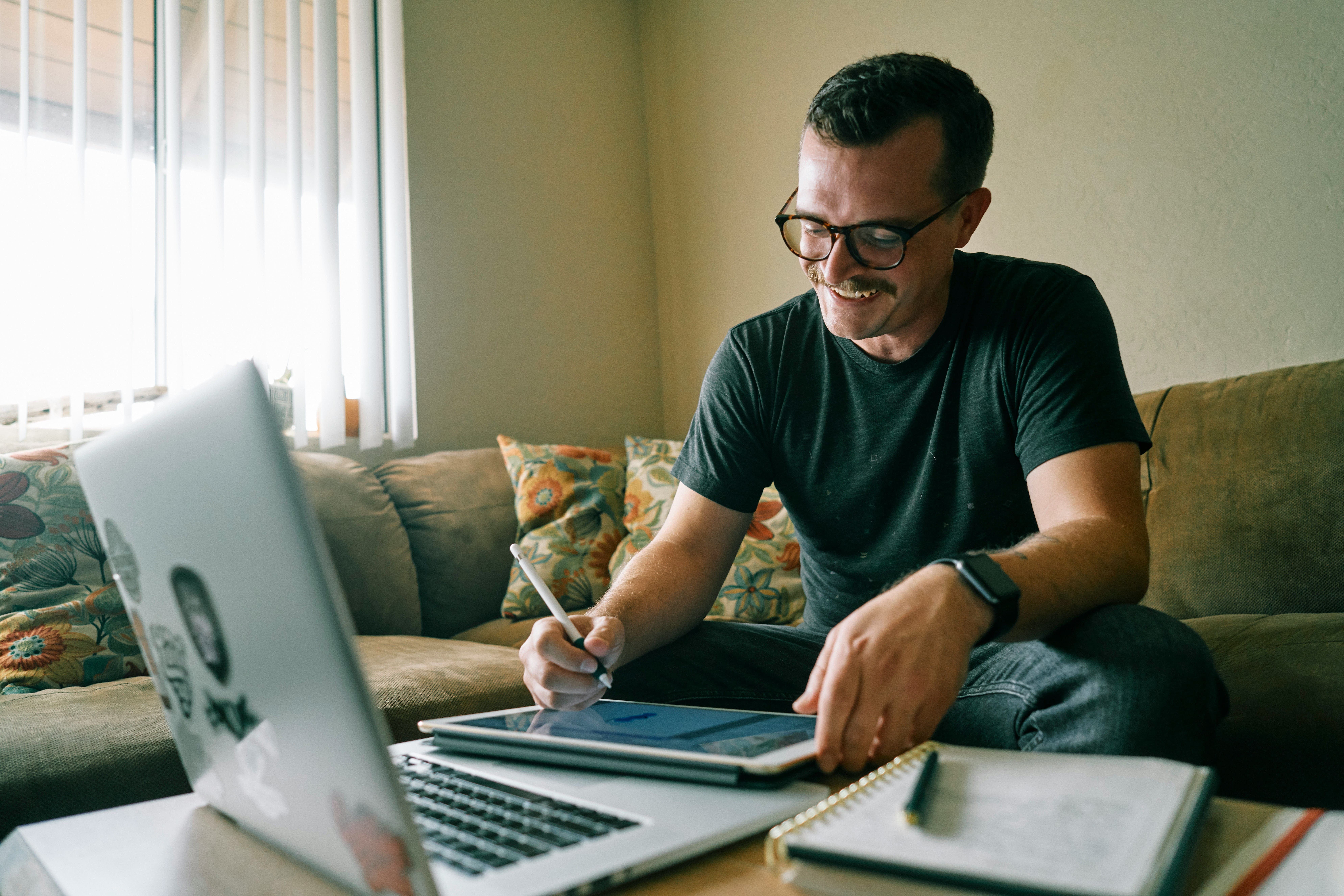 Entrepreneur signing a service contract on a tablet, illustrating the importance of putting business relationships in writing