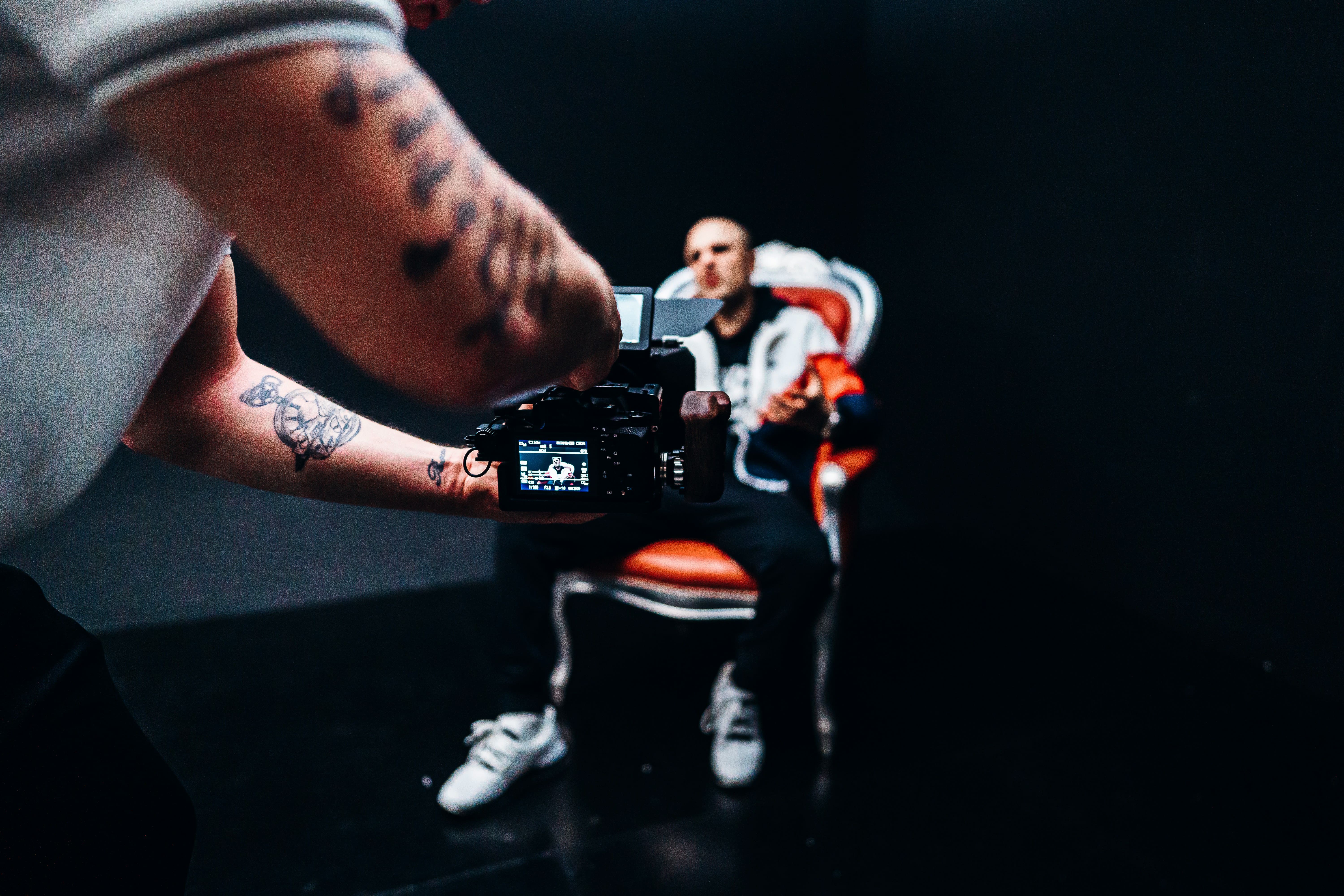 Self-employed photographer holding a camera, considering incorporating in Quebec