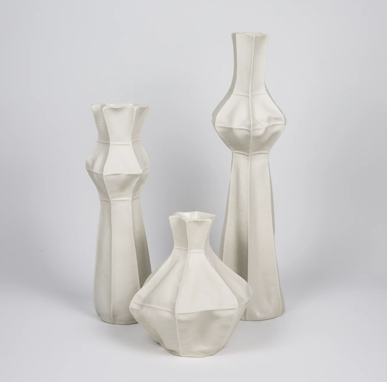 Groupings of white ceramic vessels