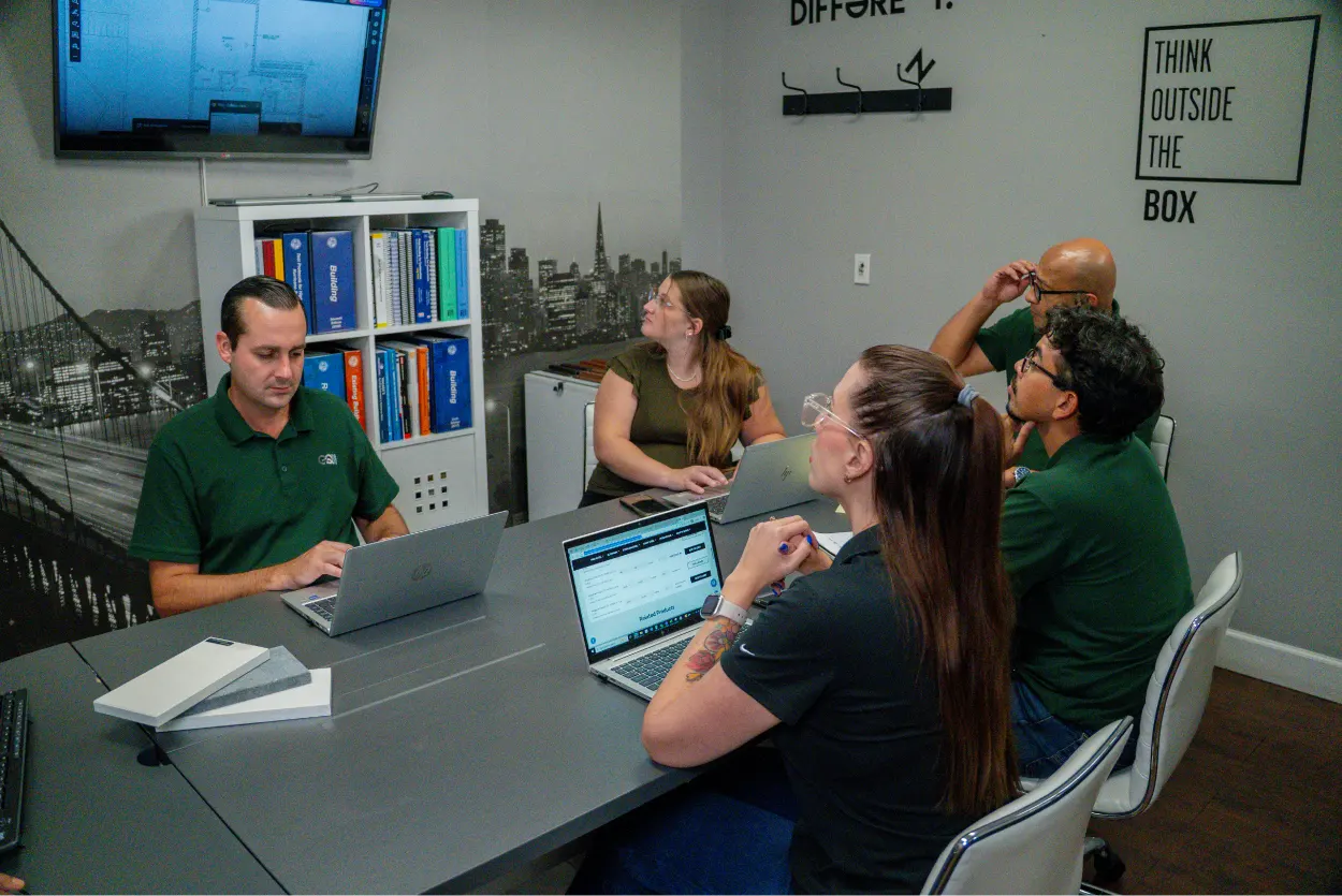 GQM Inc. project management team collaborating on construction planning and operations in Florida, ensuring precision, quality, and on-time delivery.