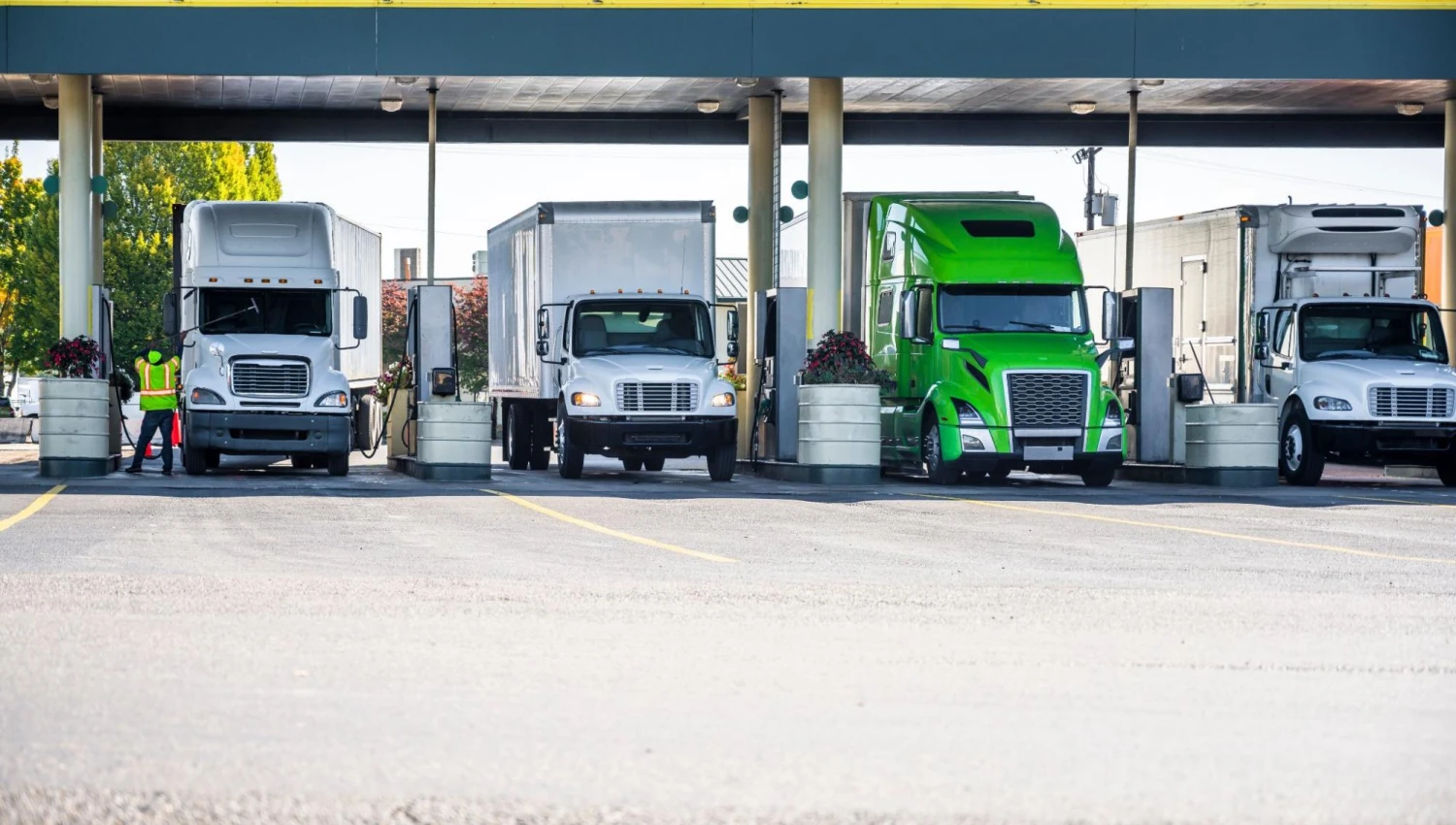 Four trucks lined up for fuel