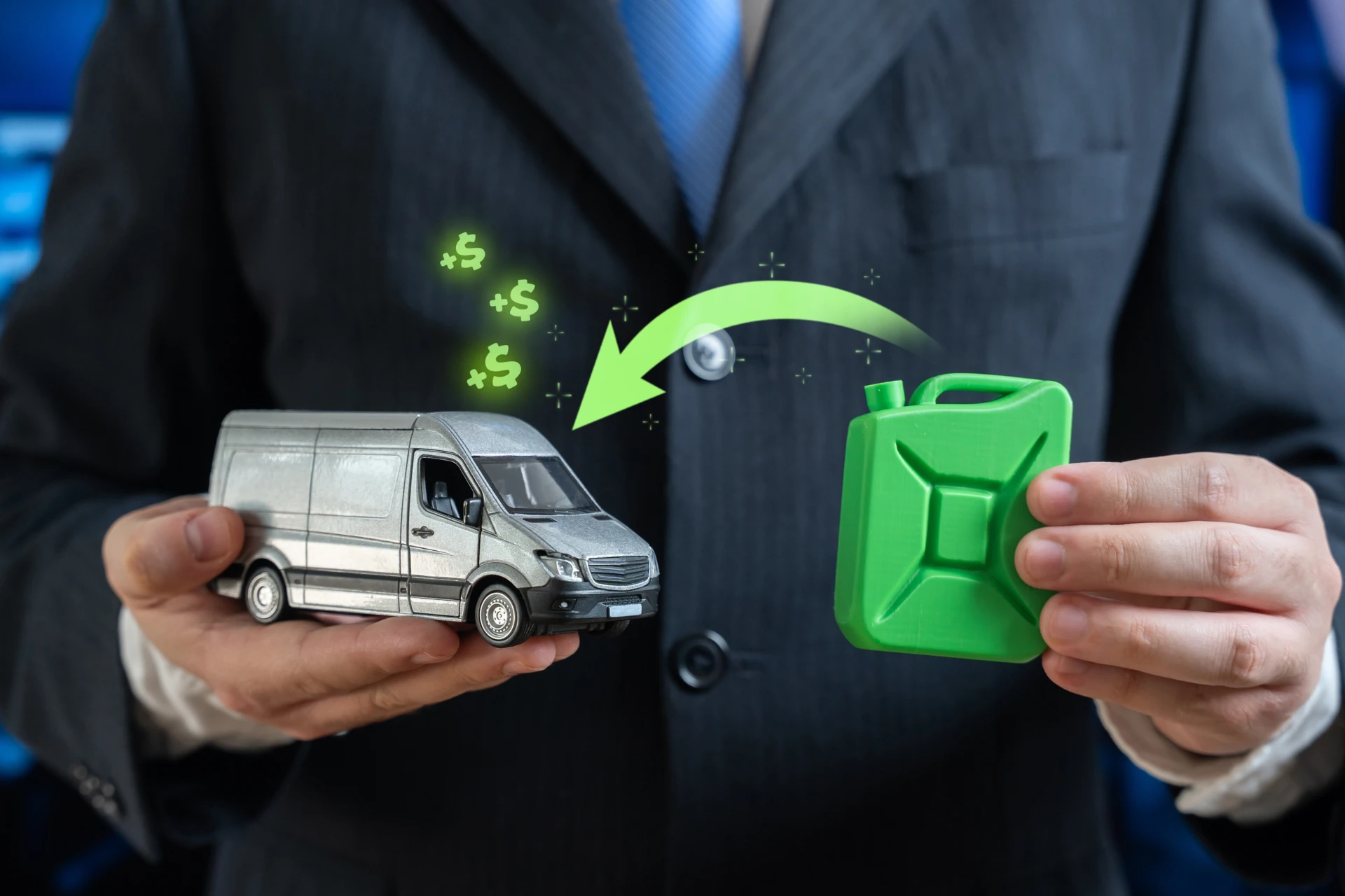 A person in a business suit holds a miniature silver delivery van in one hand and a green fuel can in the other
