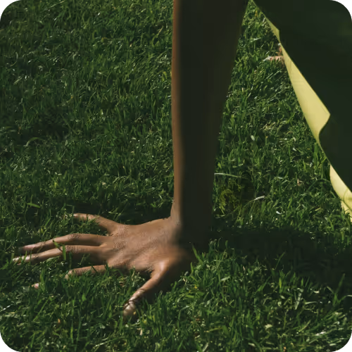 a hand on grass