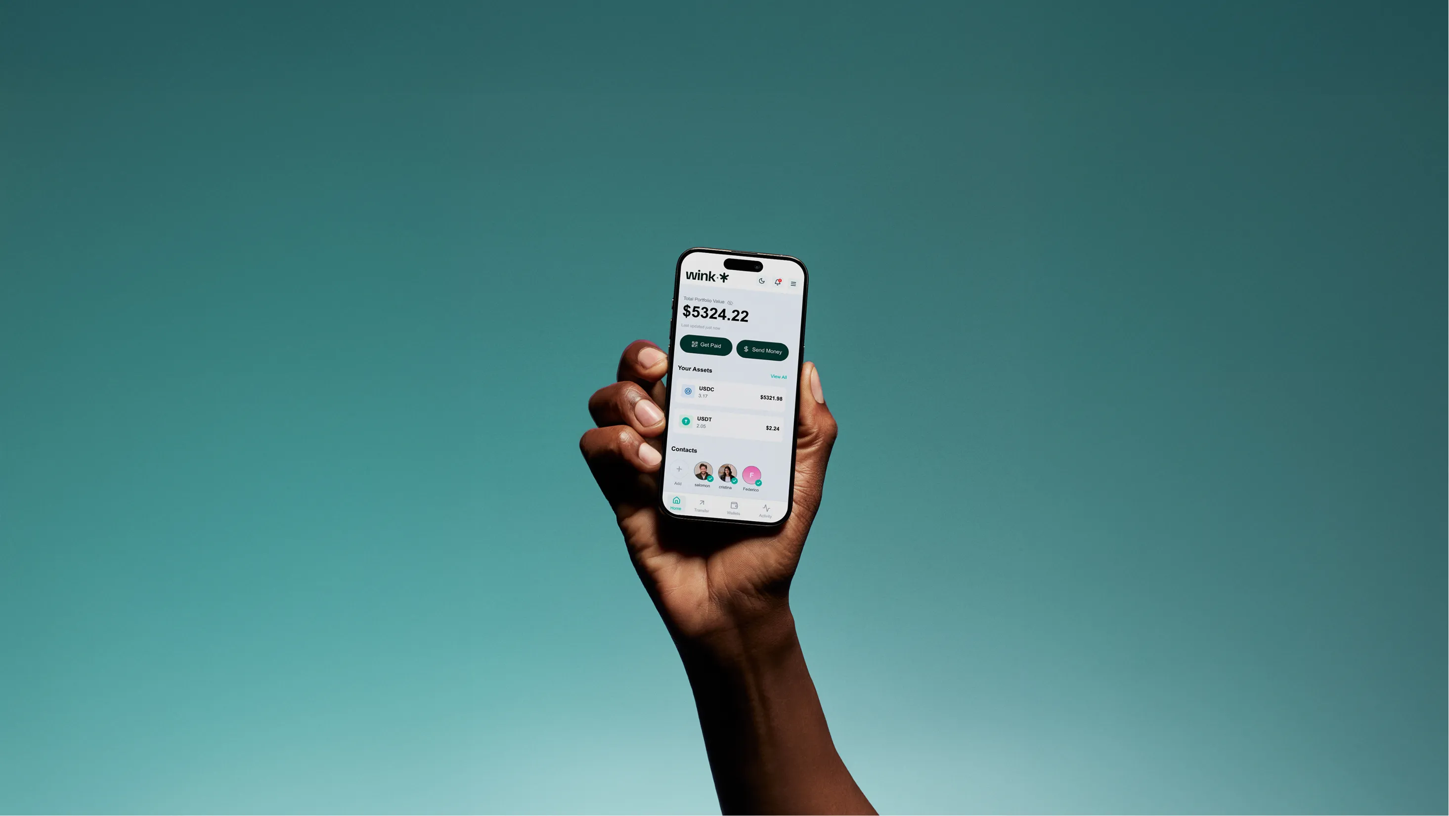 Hand holding smartphone displaying a finance app showing total portfolio value of $5324.22 and options to get paid or send money.