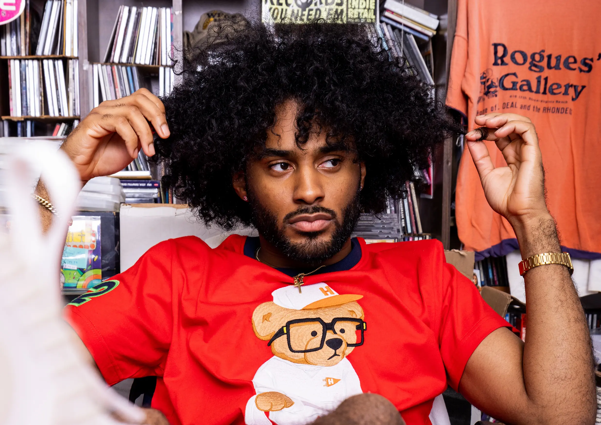 AKOO campaign photo of model inside Birdland Music record store — So & So Productions lifestyle image.