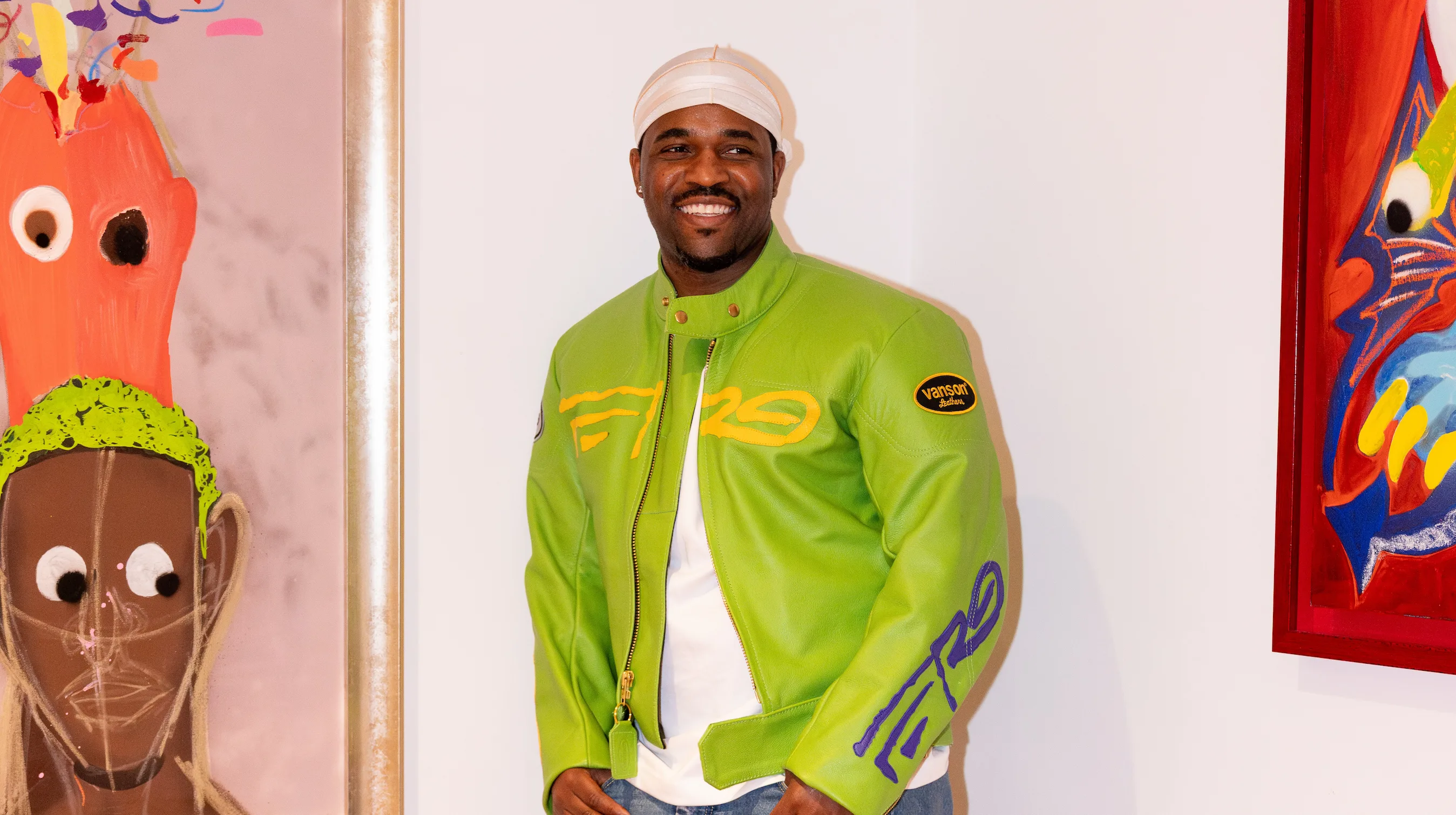 A$AP Ferg standing beside his painting at the CHOSEN Exhibition in Soho — photo by So & So Productions