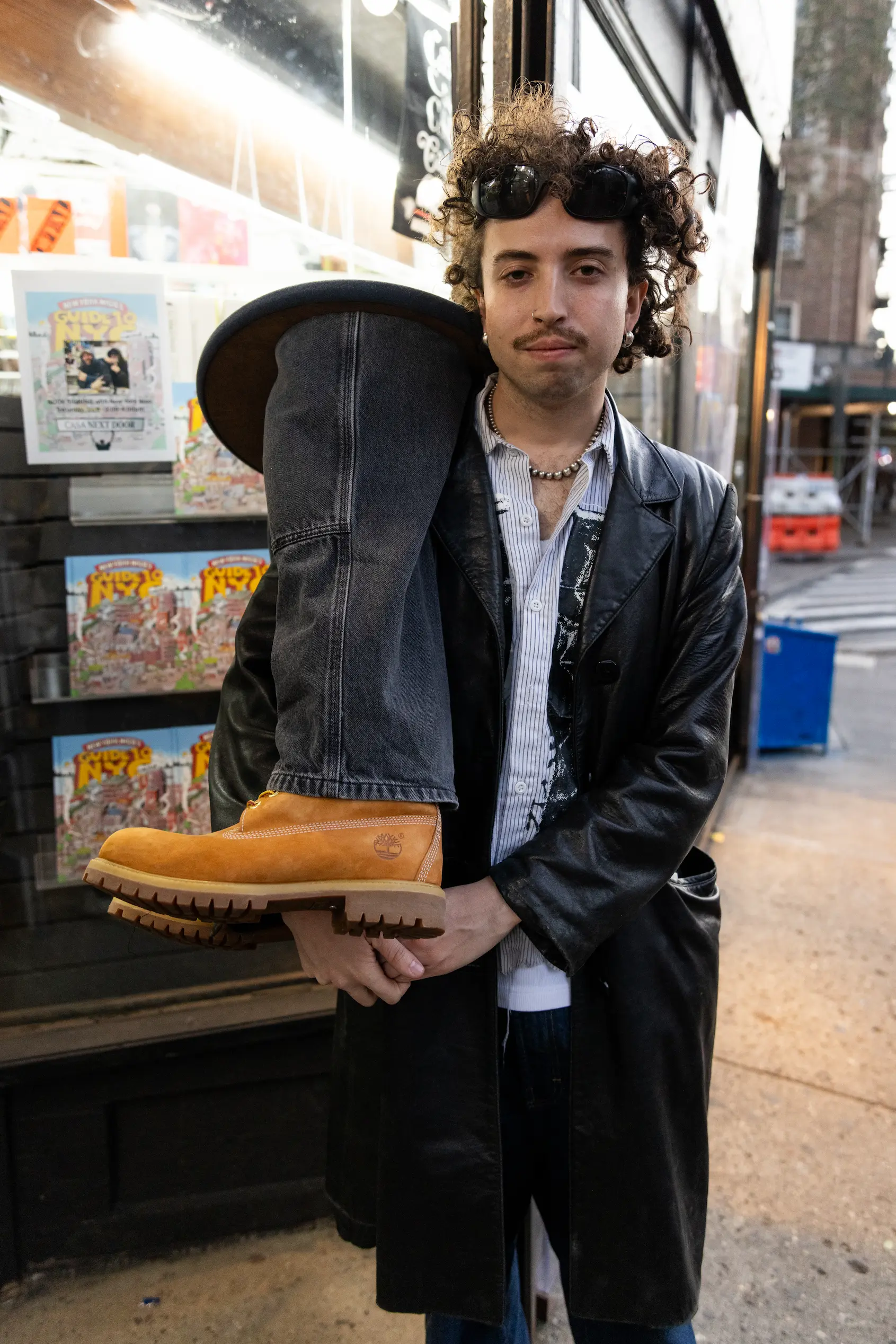 Unique “jeans and Tims” table display at Casa Magazines book signing — So & So Productions cultural documentation.