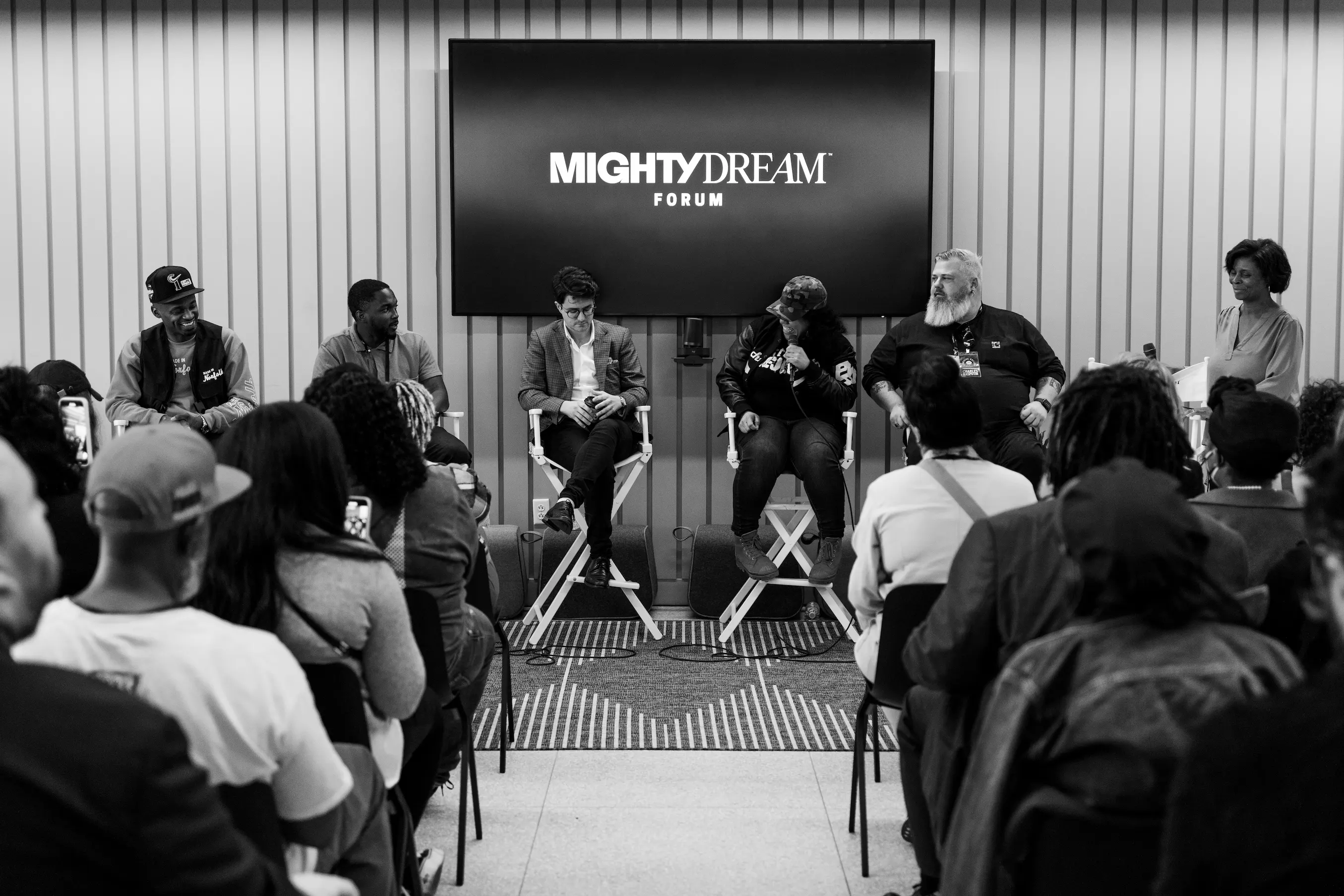 Panel moderator and attendees engaged in conversation at Mighty Dream Forum in Norfolk — So & So Productions event coverage.