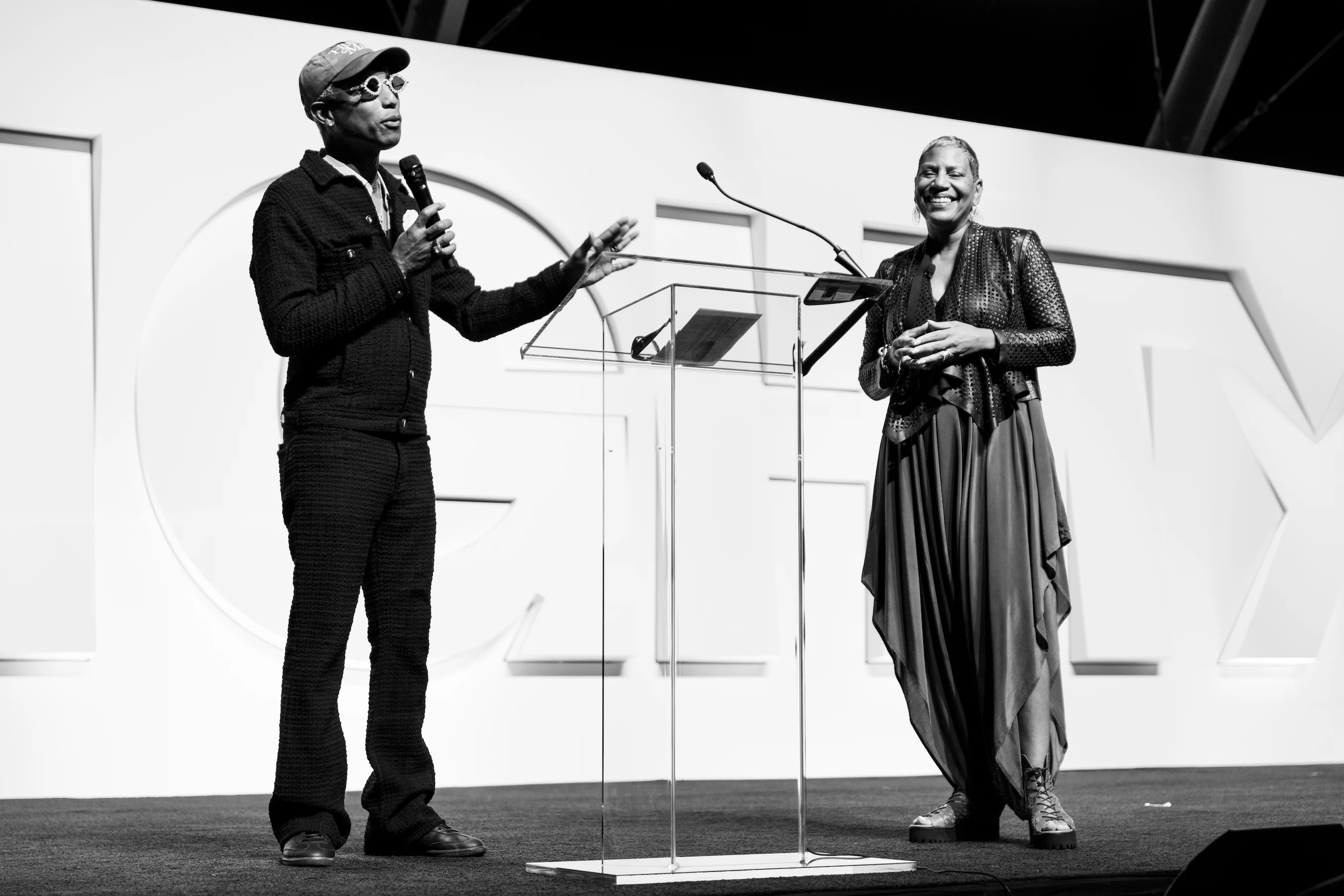 Pharrell Williams posing with business leaders during Mighty Dream Forum in Hampton Roads — So & So Productions portrait photo.