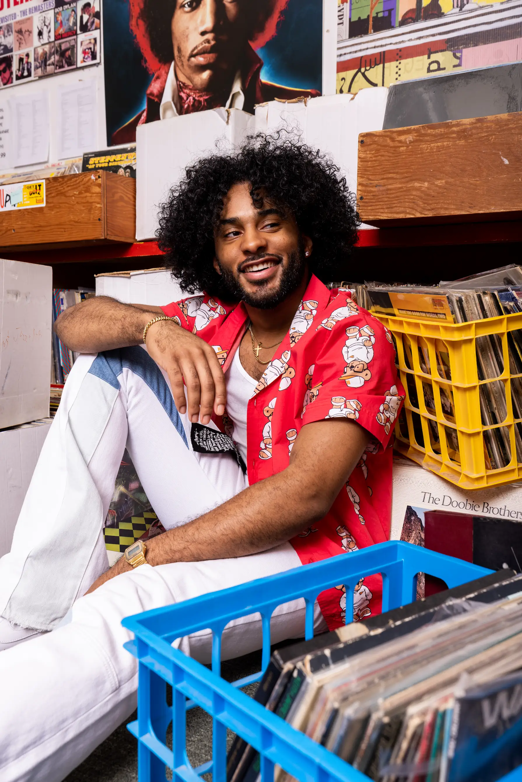 Editorial photo of AKOO campaign featuring model and records at Birdland Music in Virginia Beach — So & So Productions.