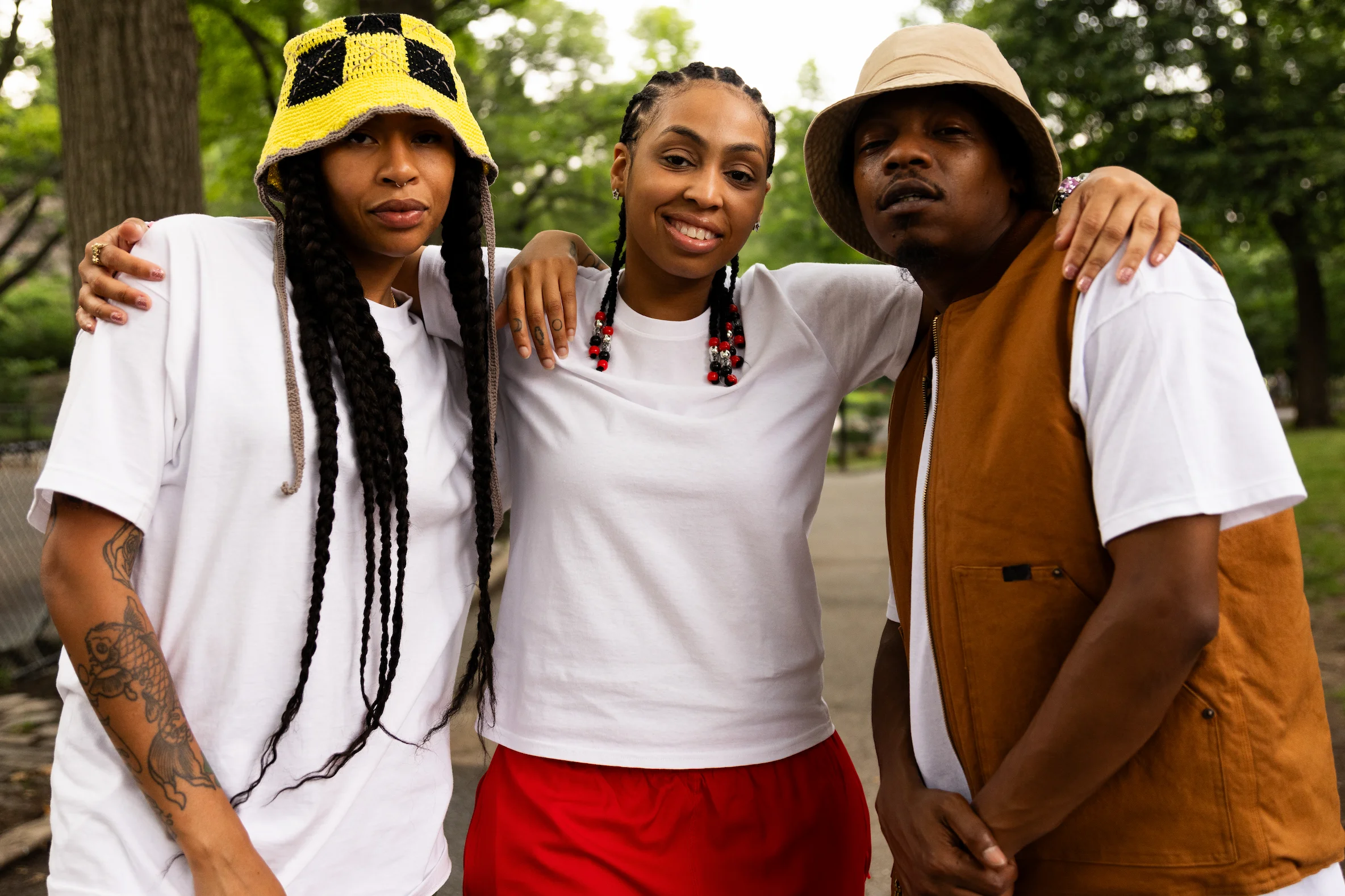 Group photo featuring artists wearing Hanes white tees for hip-hop culture tribute — So & So Productions