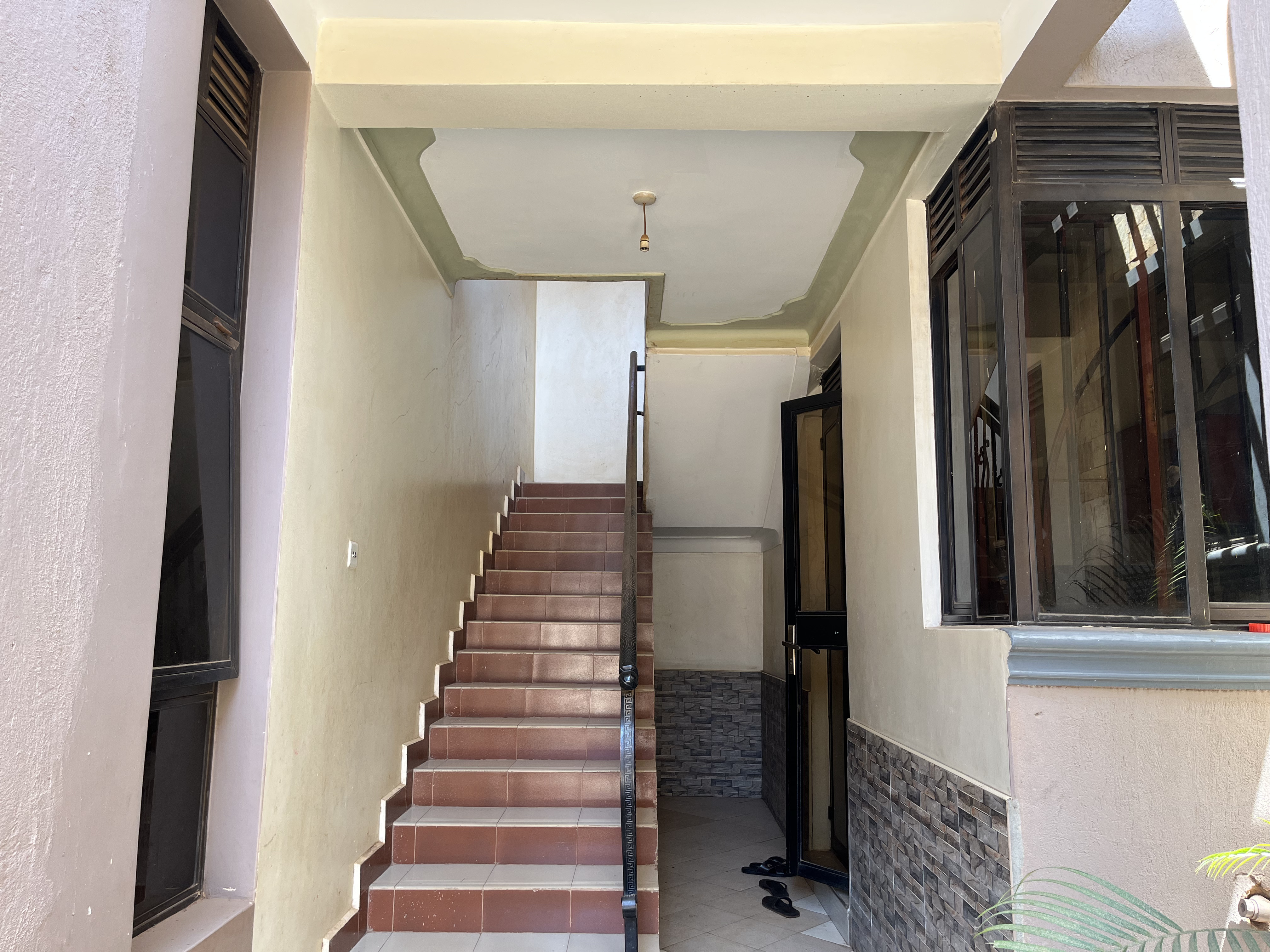 Apartment building with deeded parking spaces on tarmacked road in Wakiso District