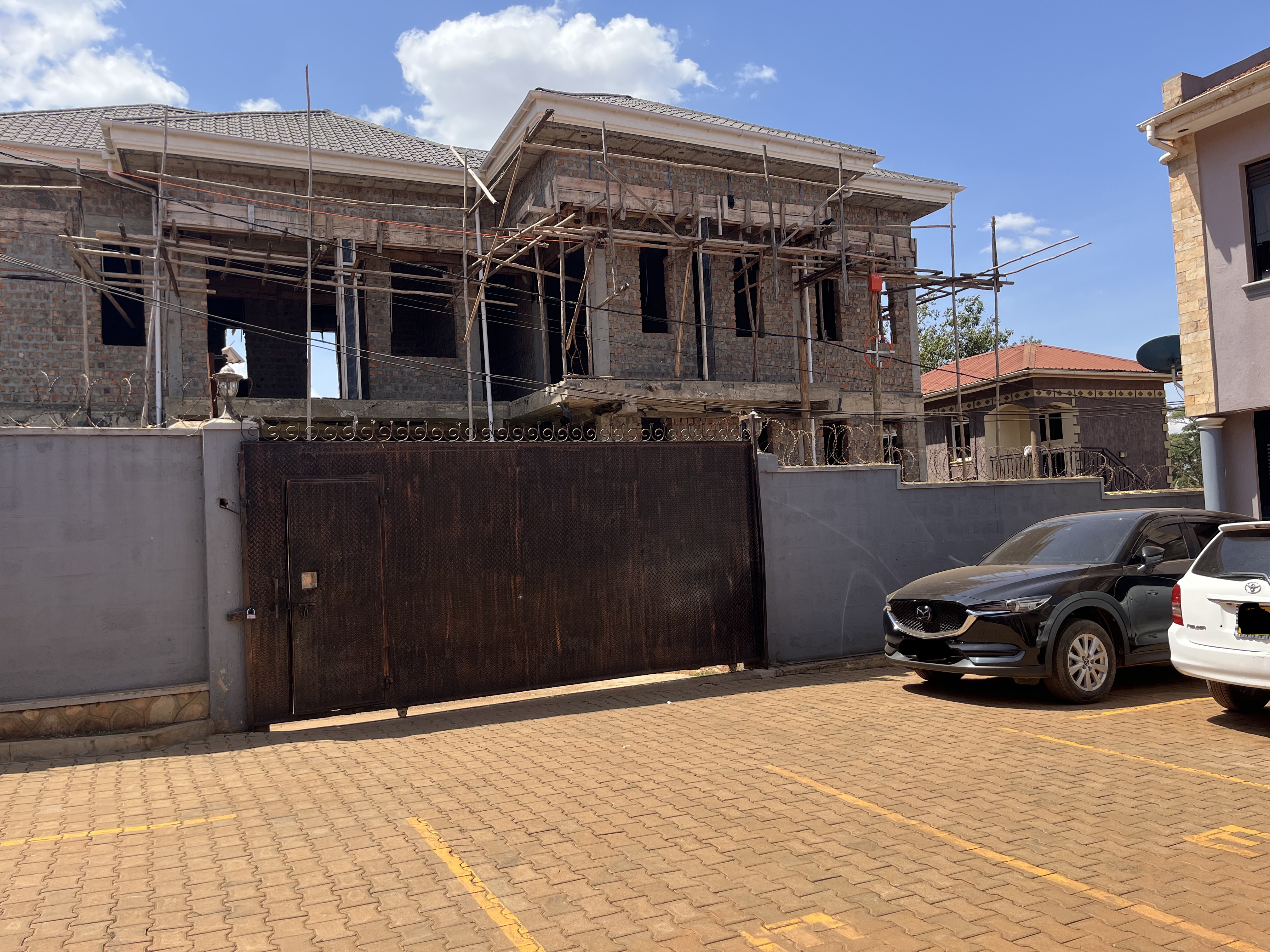 Apartment block exterior showing balconies and modern finishes in Wakiso District