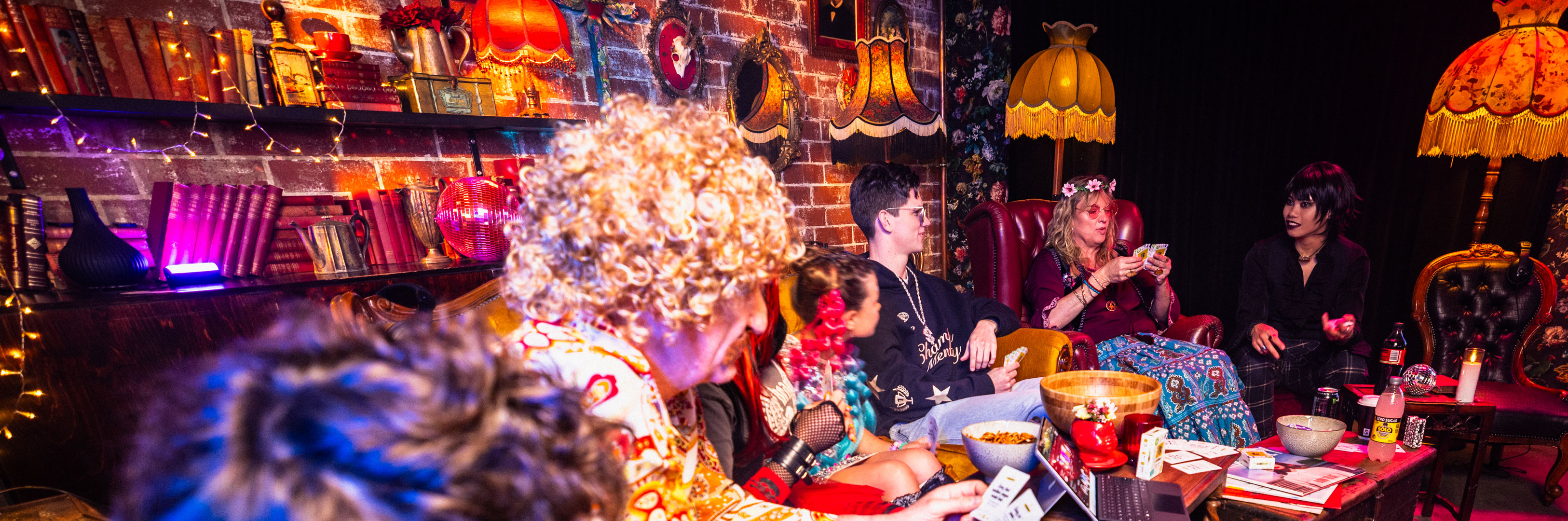 A group of people in musical genre-inspired costumes candidly playing The Playlist Game.