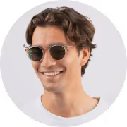 A man wearing sunglasses and a white shirt.