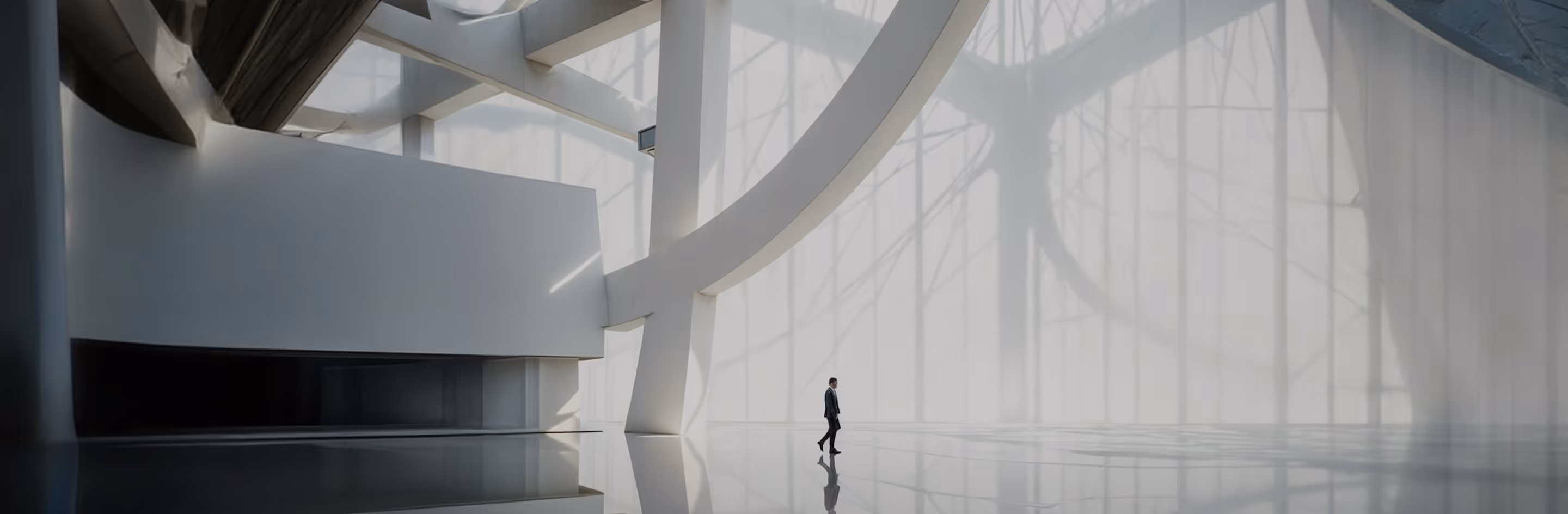 A person standing in front of a large window.