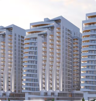 A couple of tall buildings sitting next to each other.