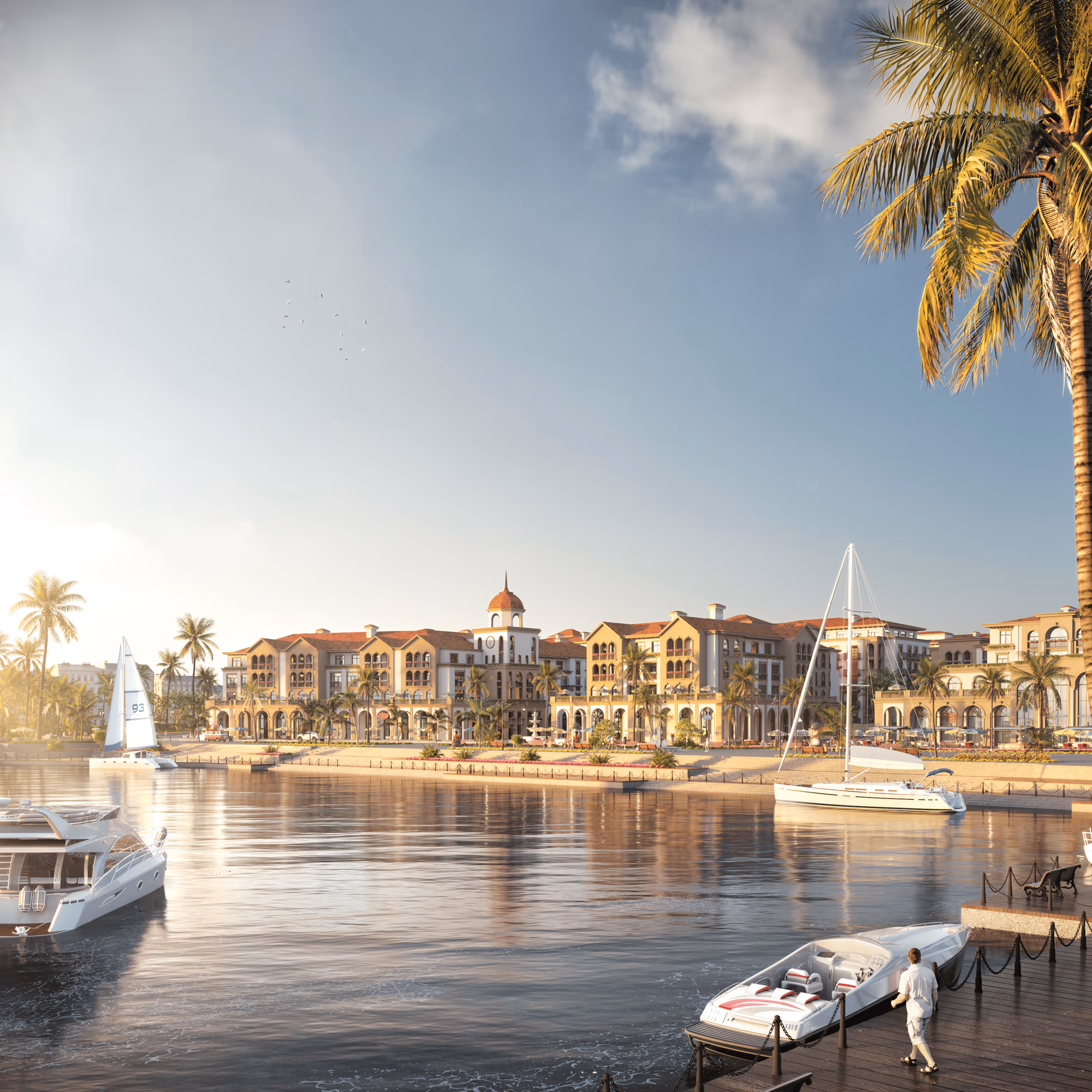 A marina with boats and palm trees on a sunny day.