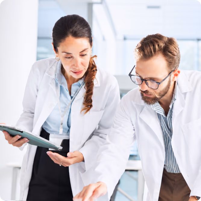 Scientists reviewing results on a tablet