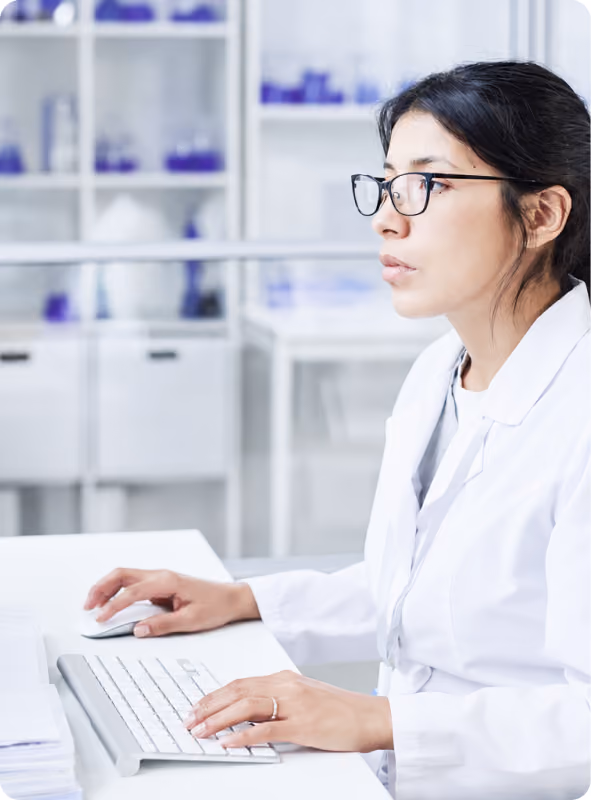 Scientist working at a computer in the lab
