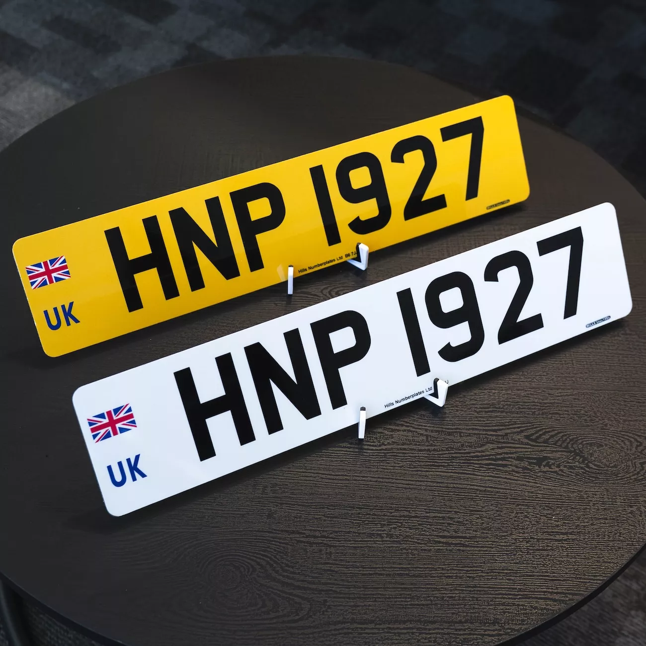 UGroup acrylic number plates showing front and rear plate pair with UK flag identifier, supplied by Hills Numberplates.