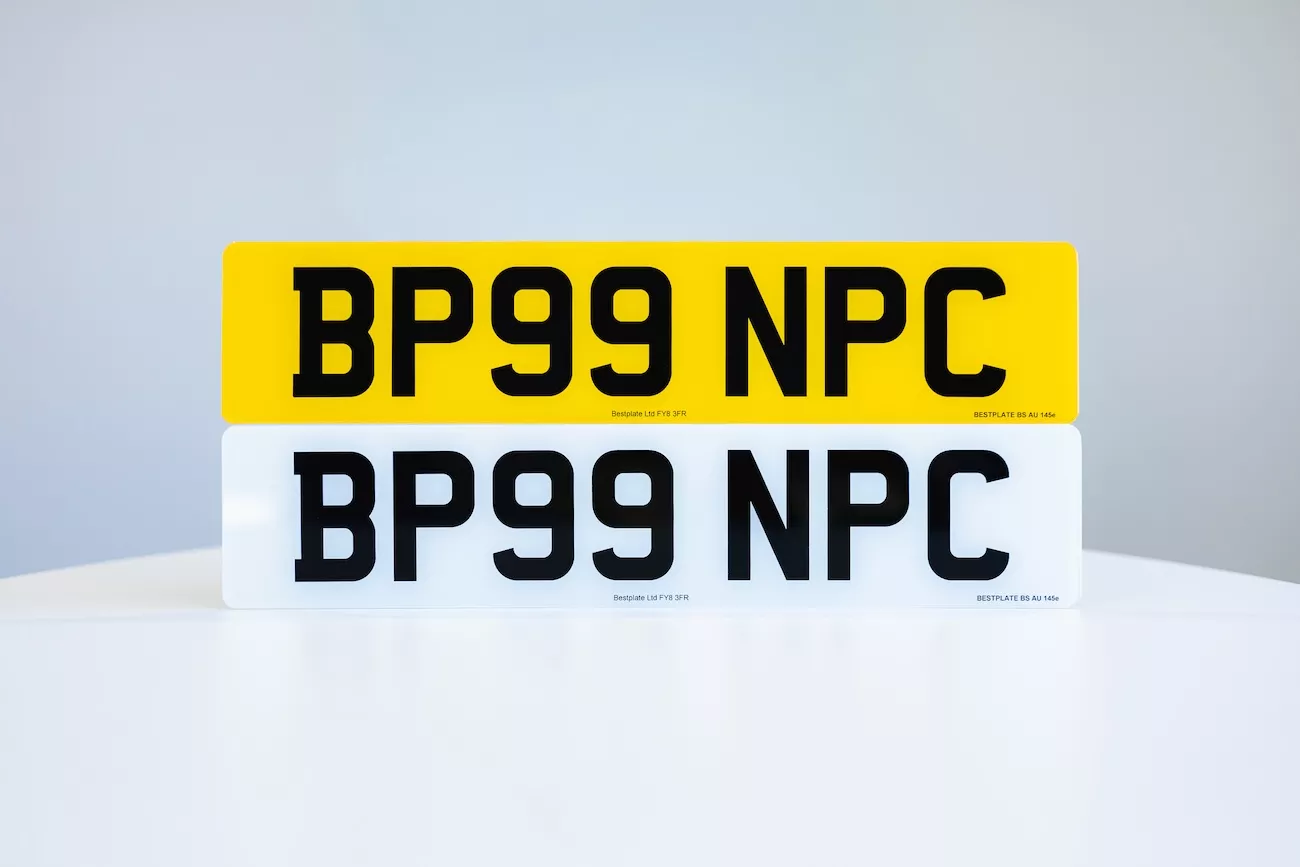Yellow front and white rear number plates showing registration BP99 NPC, standard UK compliant plate finish