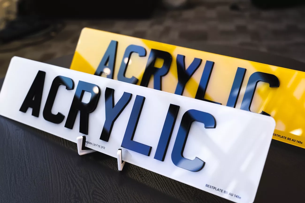4D number plates with raised gloss black acrylic characters on white front and yellow rear plates, marked BS AU 145e.