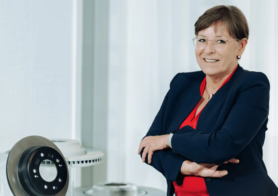 A woman in red shirt is standing ahead 