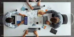 Team collaborating on a project in a modern office.